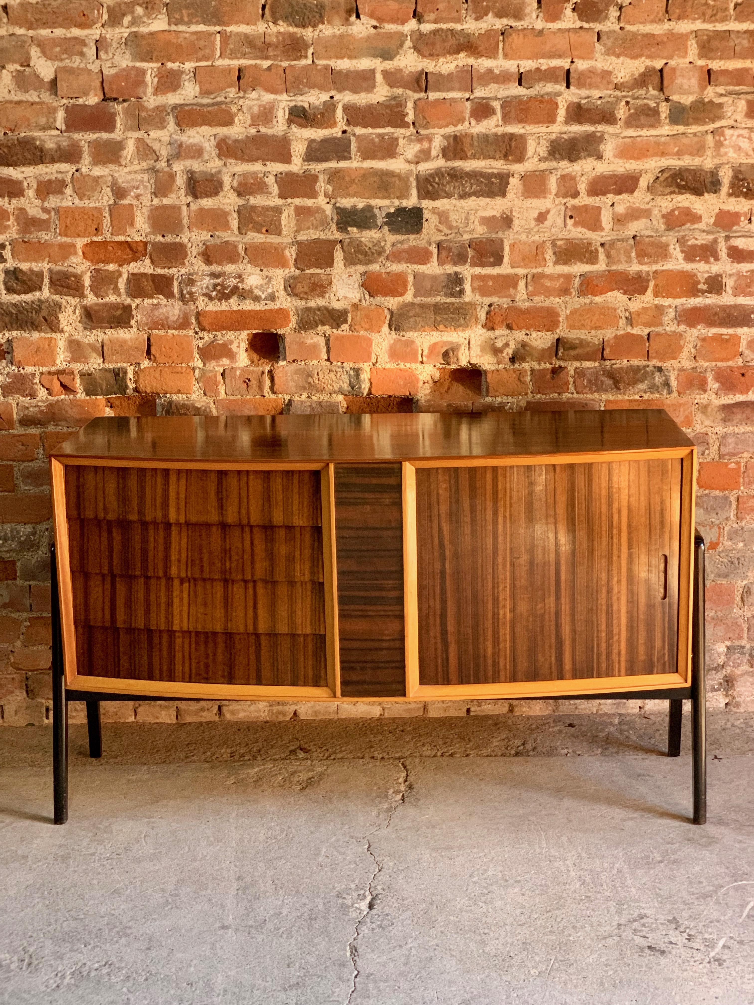 Herbert Gibbs rosewood sideboard credenza cocktail cabinet, London, circa 1950.

Herbert E Gibbs Ltd London, magnificent rosewood sideboard credenza made in the UK circa 1950s, the rectangular shaped top with four graduated drawers, single