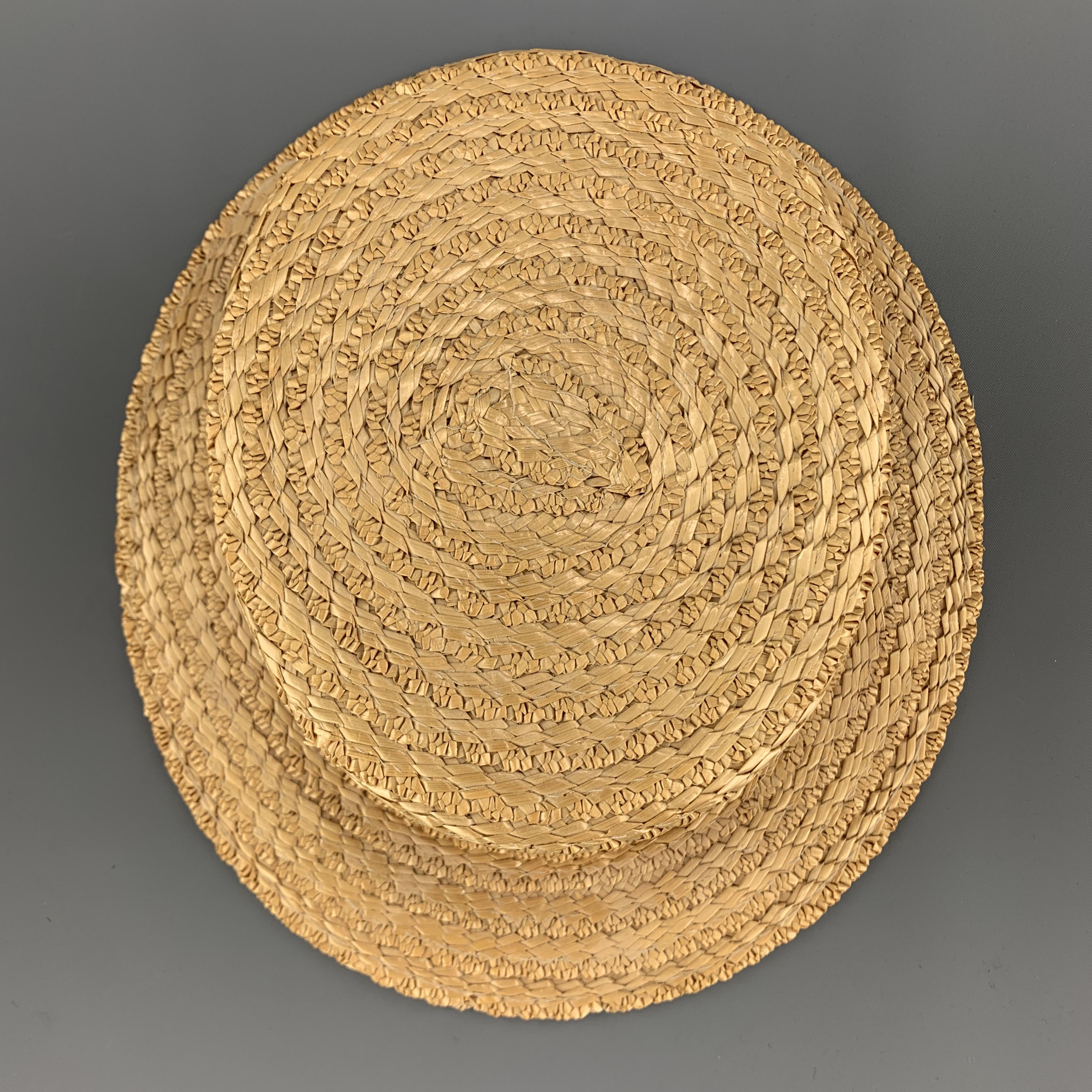 HERBERT JOHNSON Boater hat comes in natural woven straw with a red and navy striped grosgrain trim and mesh interior. Made in England.

Very Good Pre-Owned Condition.
Marked: 58  7 1/8

Measurements:

Opening: 24.75 in.
Brim: 2 in.
Height: 3.25 in.