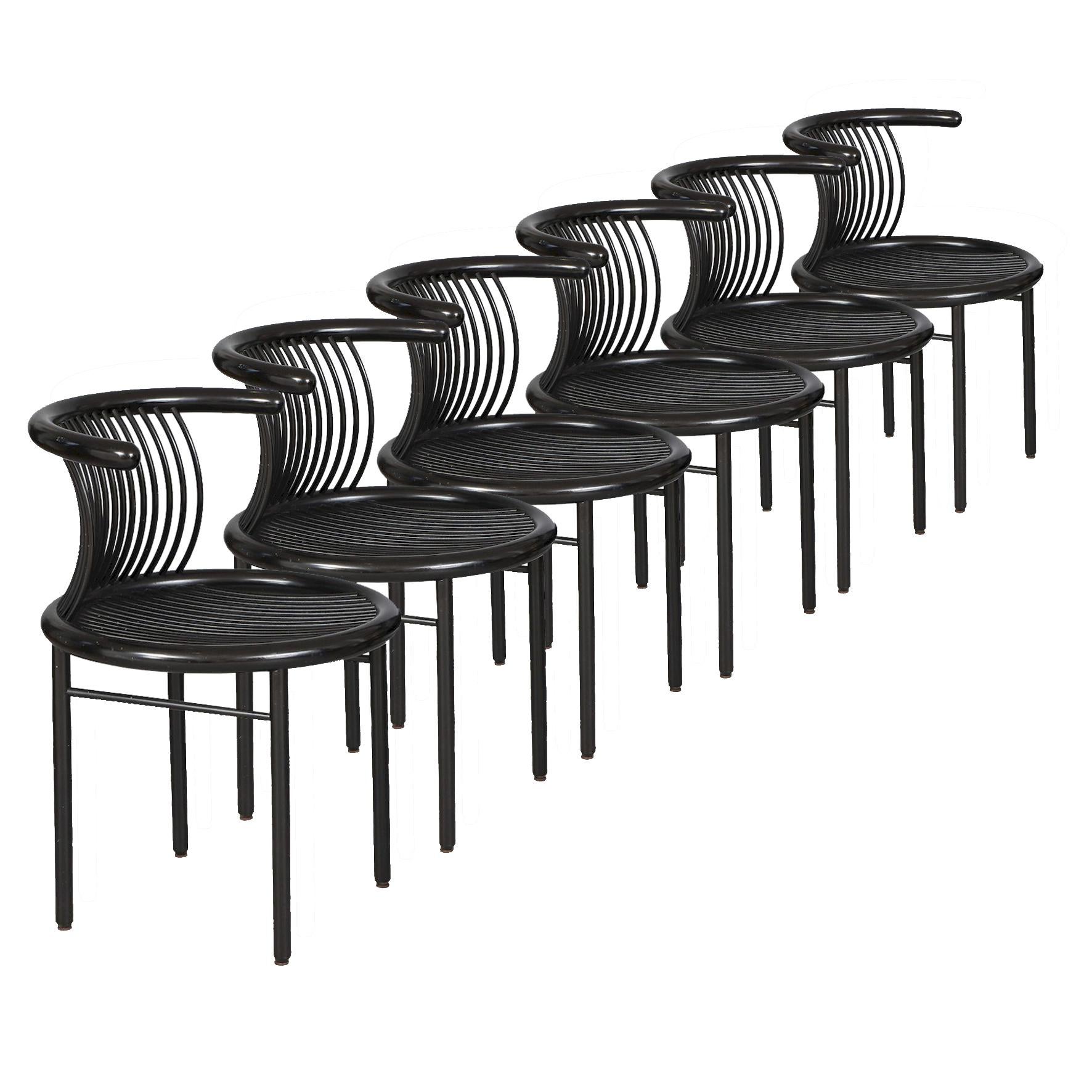 Herbert Ohl (1926-2012)

Circo

A beautiful set of six black lacquered wood dining chairs, the round seat and arched back all joined with stretchers. Each on four cylinder feet joined by a stretcher on each side.
Edited par Lübke, Germany.
Circa