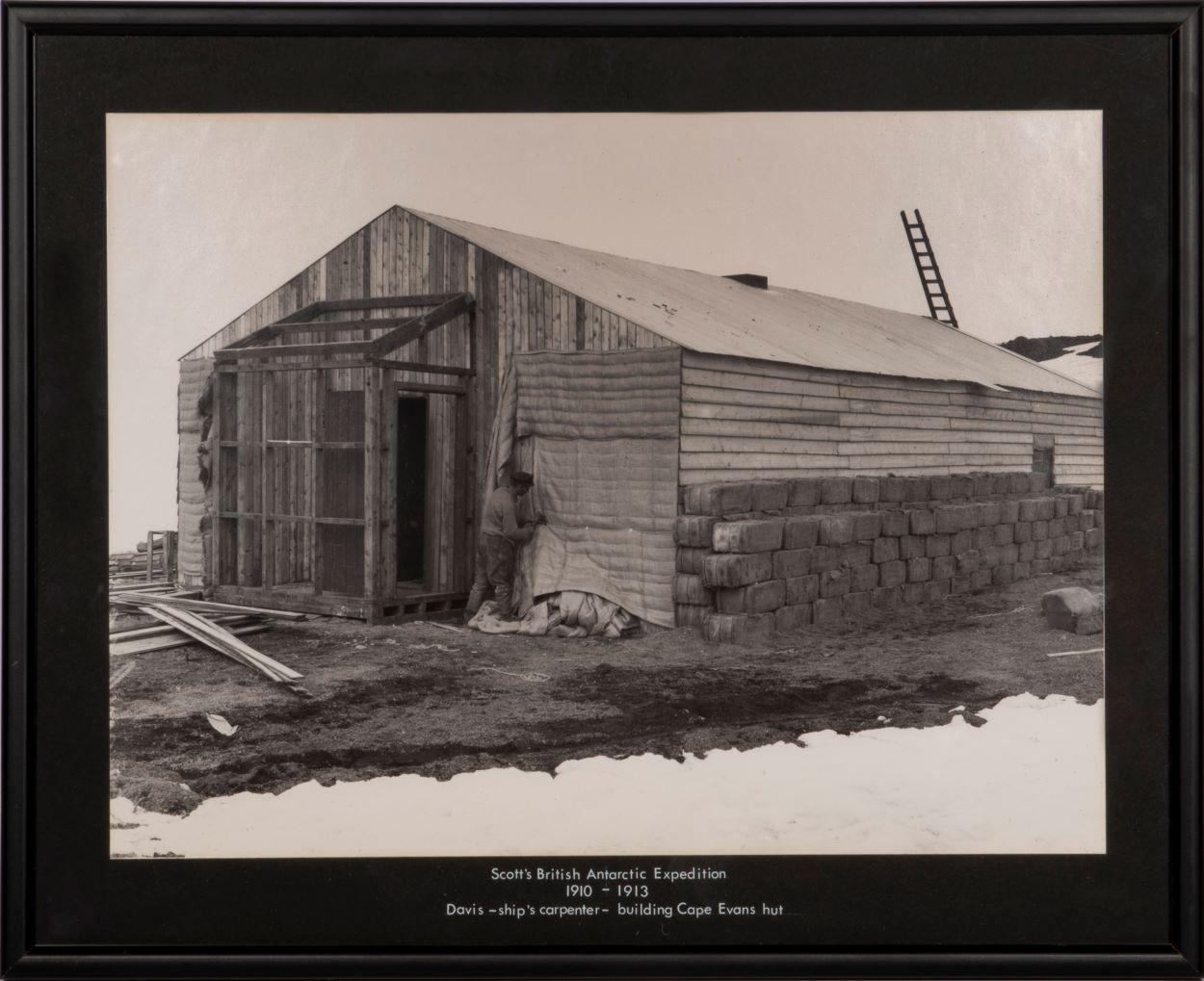 Herbert Ponting Black and White Photograph - Davis - ships carpenter - building Cape Evans hut. 