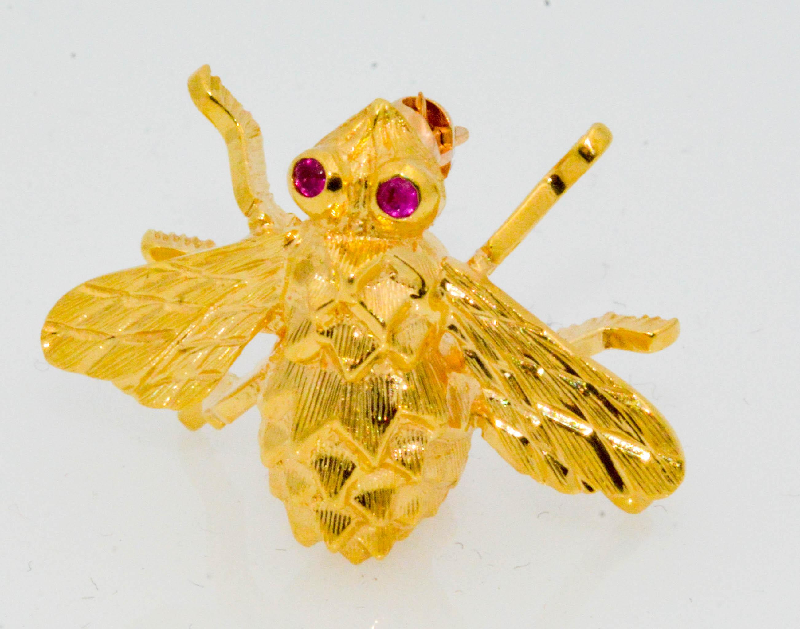 Another masterpiece creation by designer Herbert Rosenthal in this 18 karat yellow gold charming little bee brooch. This dainty little fellow has 2 ruby eyes (.04 ct) on his charming little face. Notice the intricate details on the body, wings and