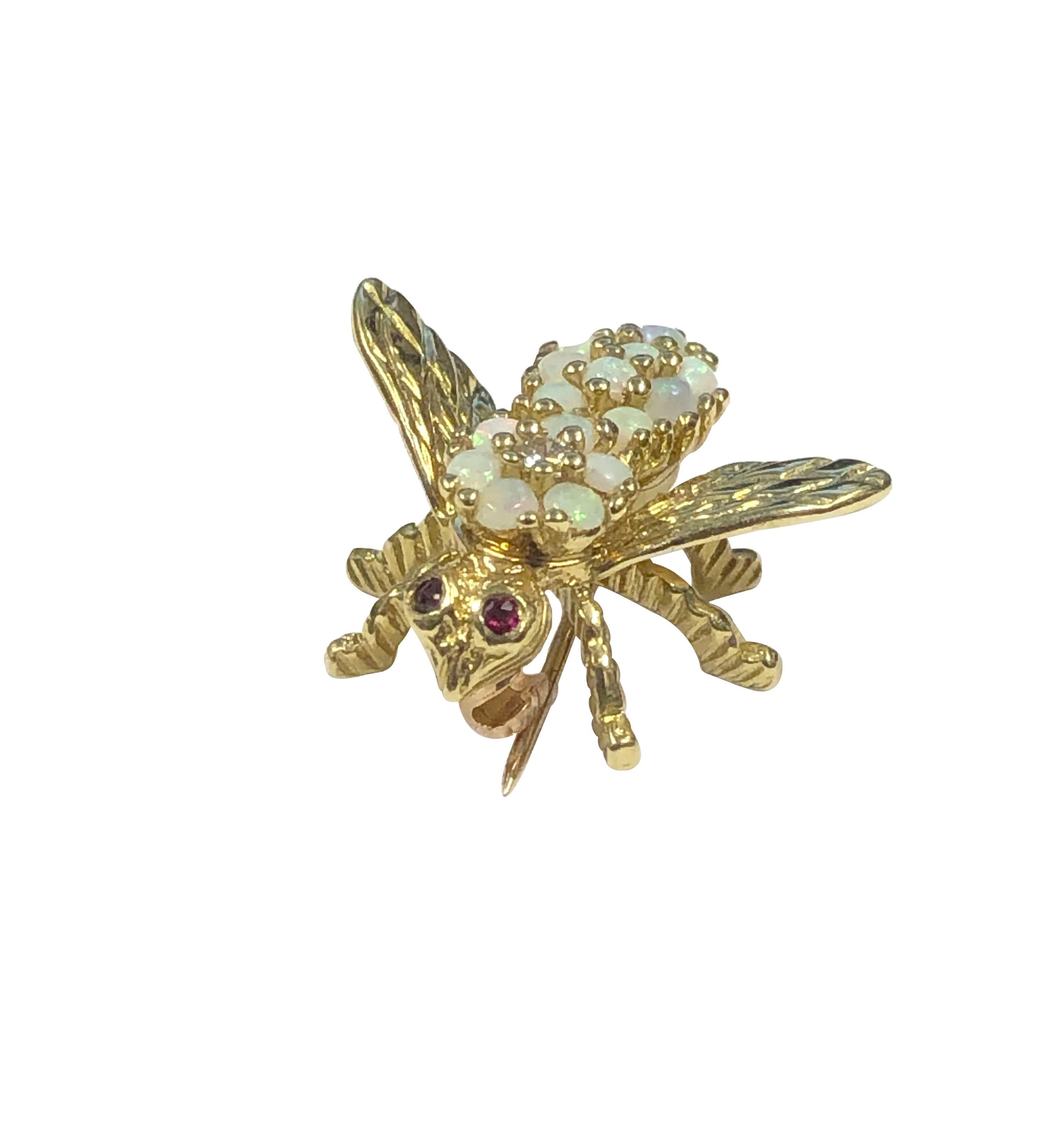 Circa 1960s Herbert Rosenthal 18k Yellow Gold Bee Brooch, measuring 5/8 inch in length X 3/4 inch wing tip to tip. Set with Opals, Diamond and Ruby set Eyes.  