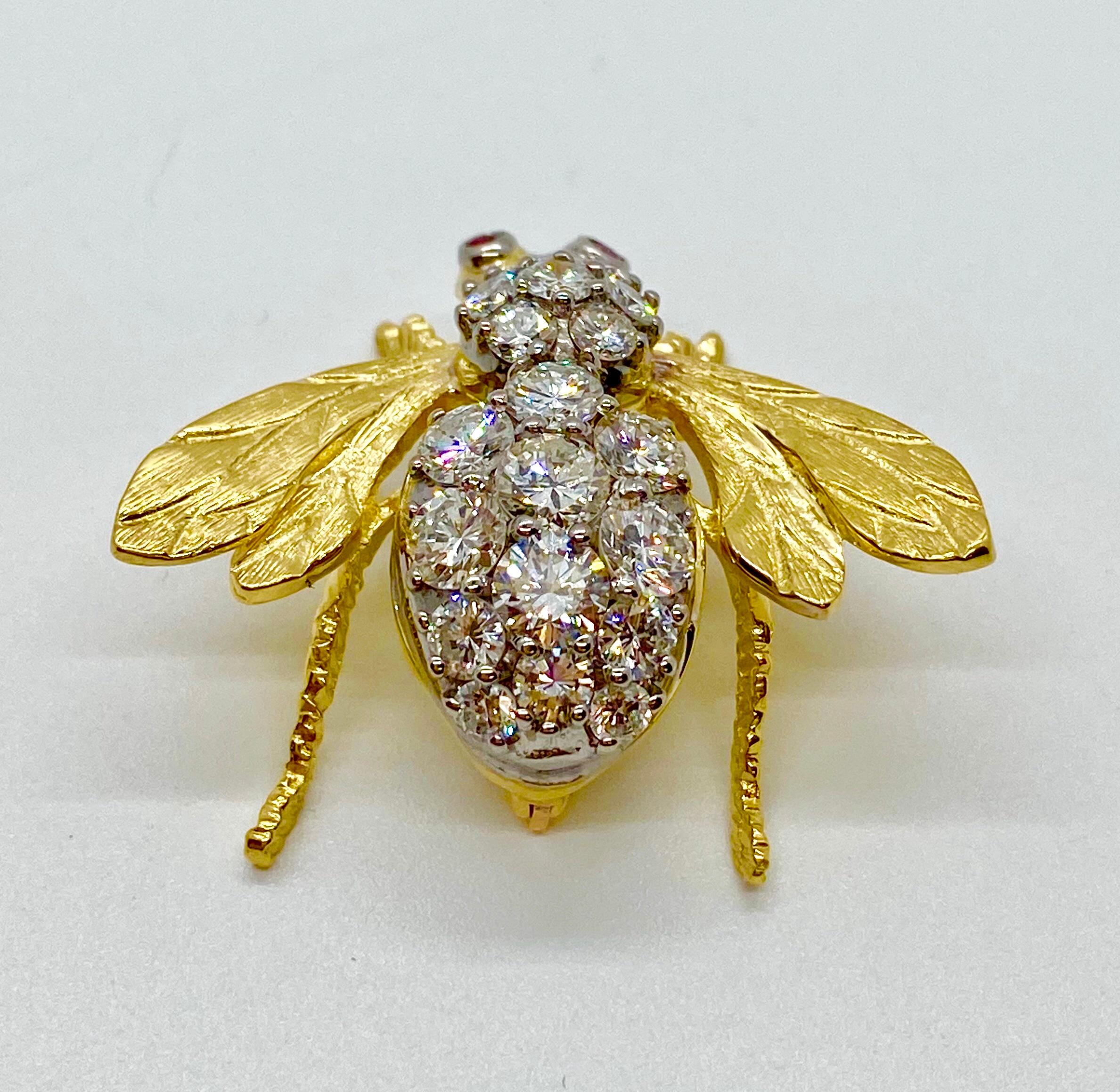 Vintage 18K yellow and white gold diamond bumble bee large brooch pin by Herbert Rosenthal.  There are 19 round brilliant cut diamonds weighing approximately 3.55 carat total weight G-H color and VS2 quality.  Bee has round ruby eyes weighing 0.10