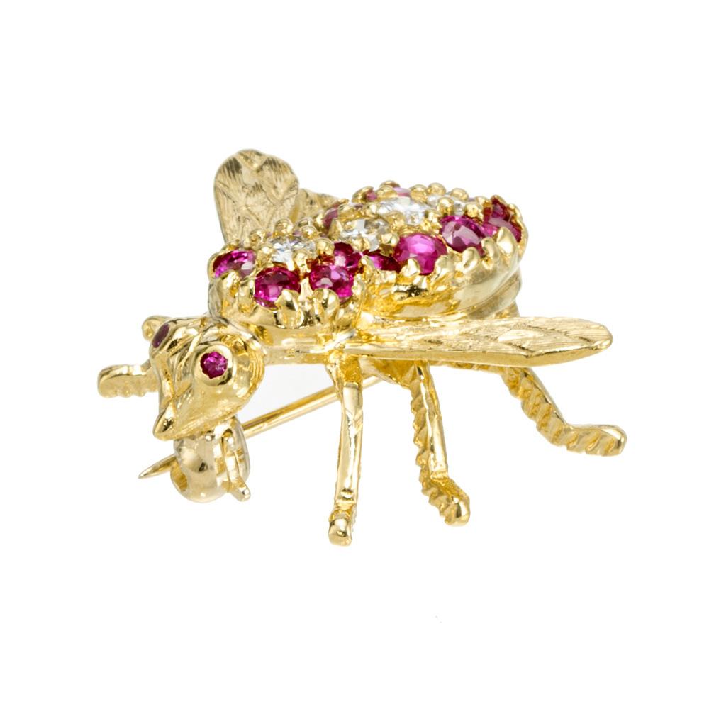 Whimsical Herbert Rosenthal ruby diamond bee brooch. 4 round brilliant cut diamonds surrounded by 17 round red rubies. 18k yellow.

17 round red rubies, approx. .40cts
4 round brilliant cut diamonds, G-H VS approx. .15cts
18k yellow gold 
Stamped: