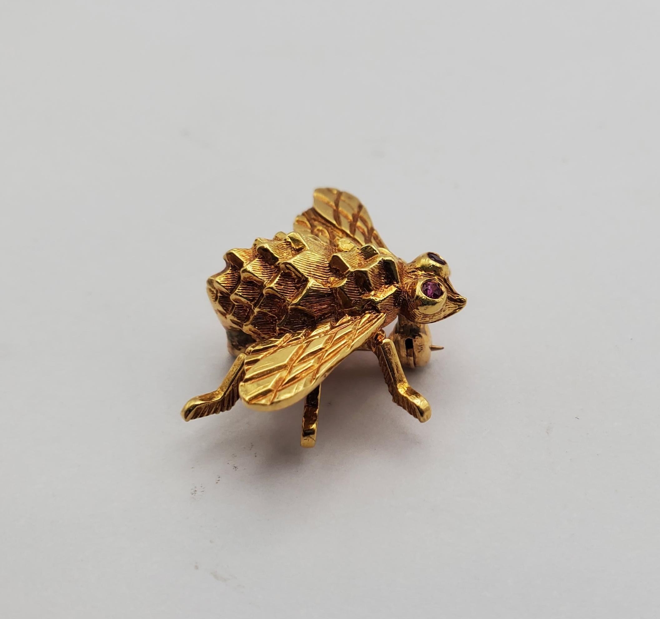 This charming bee pin by Herbert Rosenthal features intricate detail, crafted in 18k yellow gold with round natural rubies for eyes. The exquisite design displays high quality workmanship with its truly outstanding and realistic appearance. The