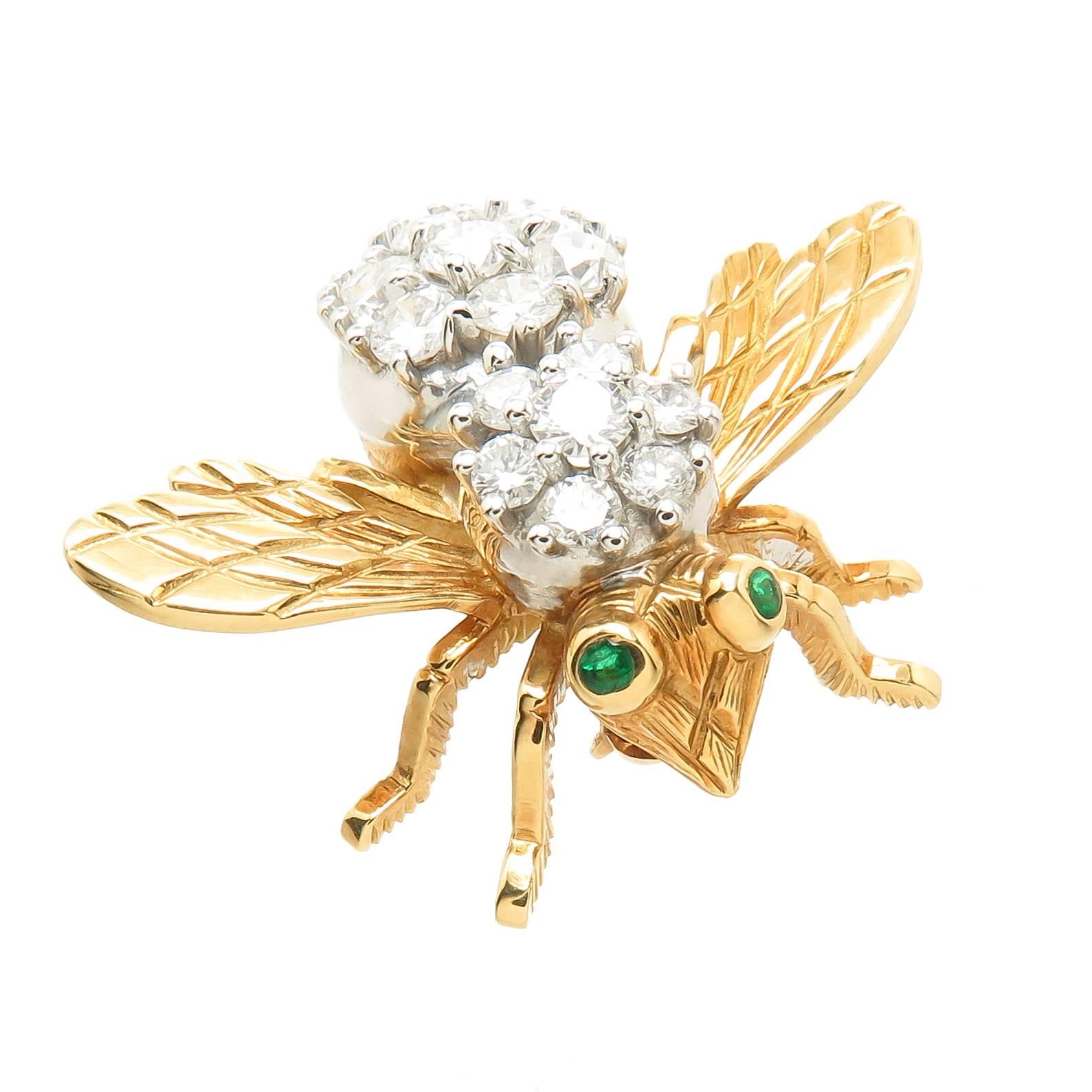 Circa 1980s Herbert Rosenthal 18K yellow Gold Bee brooch, measuring 1 1/8 inch in length and 1 3/8 inch wing tip to tip. Set with fine White, Round Brilliant cut Diamonds totaling 2 Carats and further set with Emerald Eyes.
