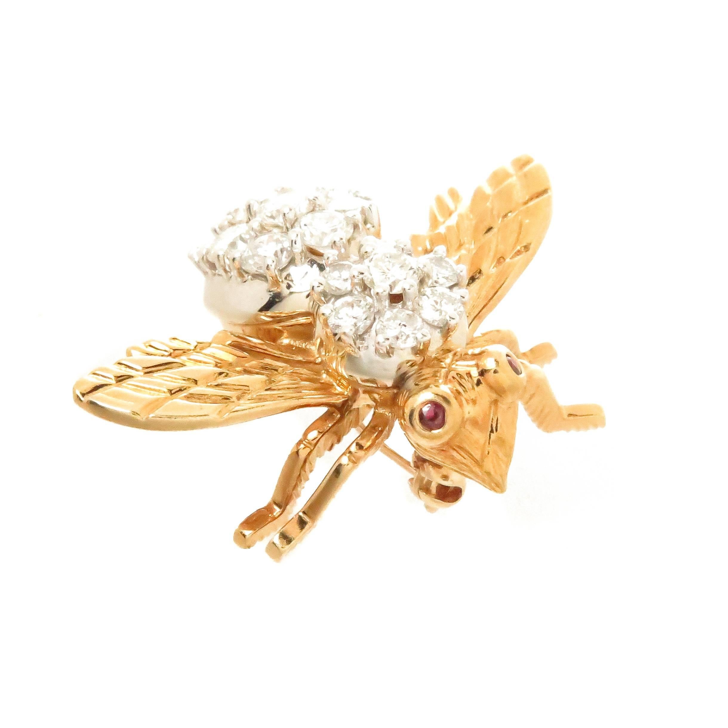 Circa 1970s Herbert Rosenthal Bee Brooch, measuring 1 inch in length and 1 3/8 inches Wing tip to tip. Set with 19 fine White Round Brilliant cut Diamonds totaling 1 carat and further set with Ruby Eyes. 