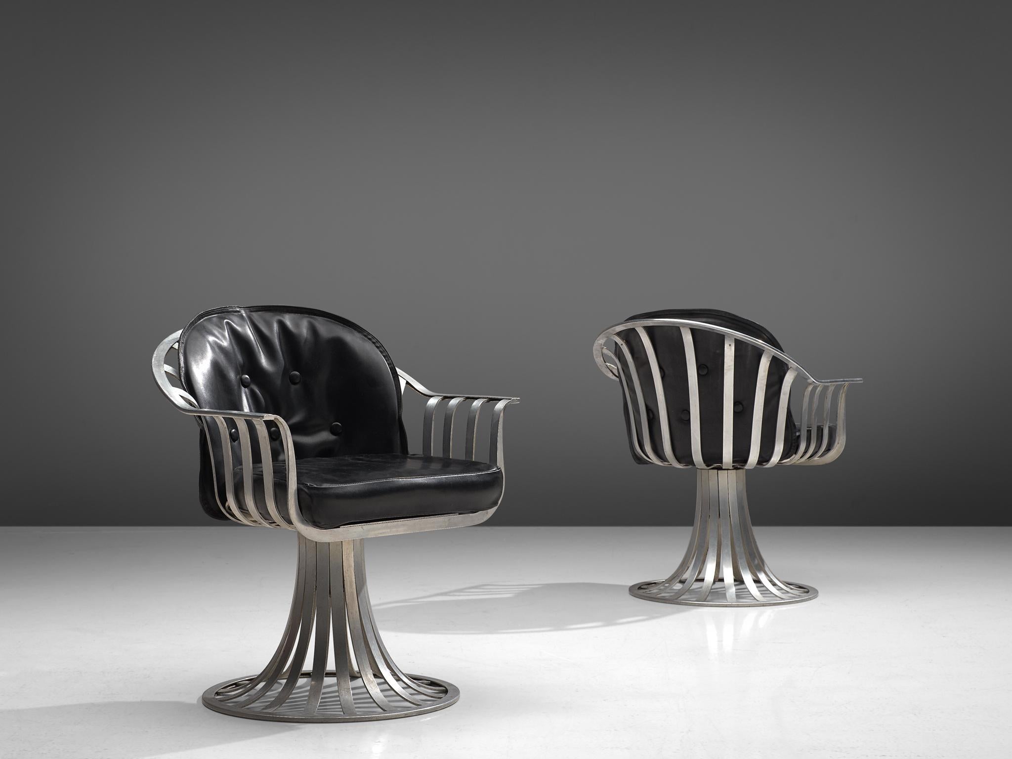 Herbert Saiger for Russell Woodard, pair of armchairs, leatherette, aluminum, United States, 1960s.

These stylized armchairs were designed by Herbert Saiger in the 1960s. Originally intended as outdoor patio furniture, it fits an indoor setting as