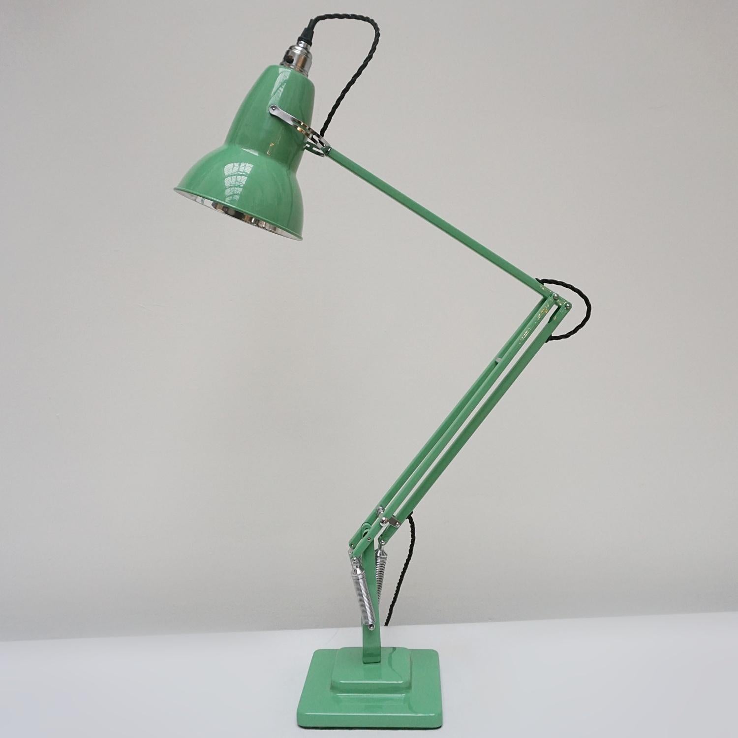 'Three-spring' chromed and polished yellow painted Anglepoise desk lamp by Herbert Terry & Sons. Two step base and perforated lamp shade. Original stamps to stem. The three spring Anglepoise lamp was first released by Herbert Terry &Sons in 1935.