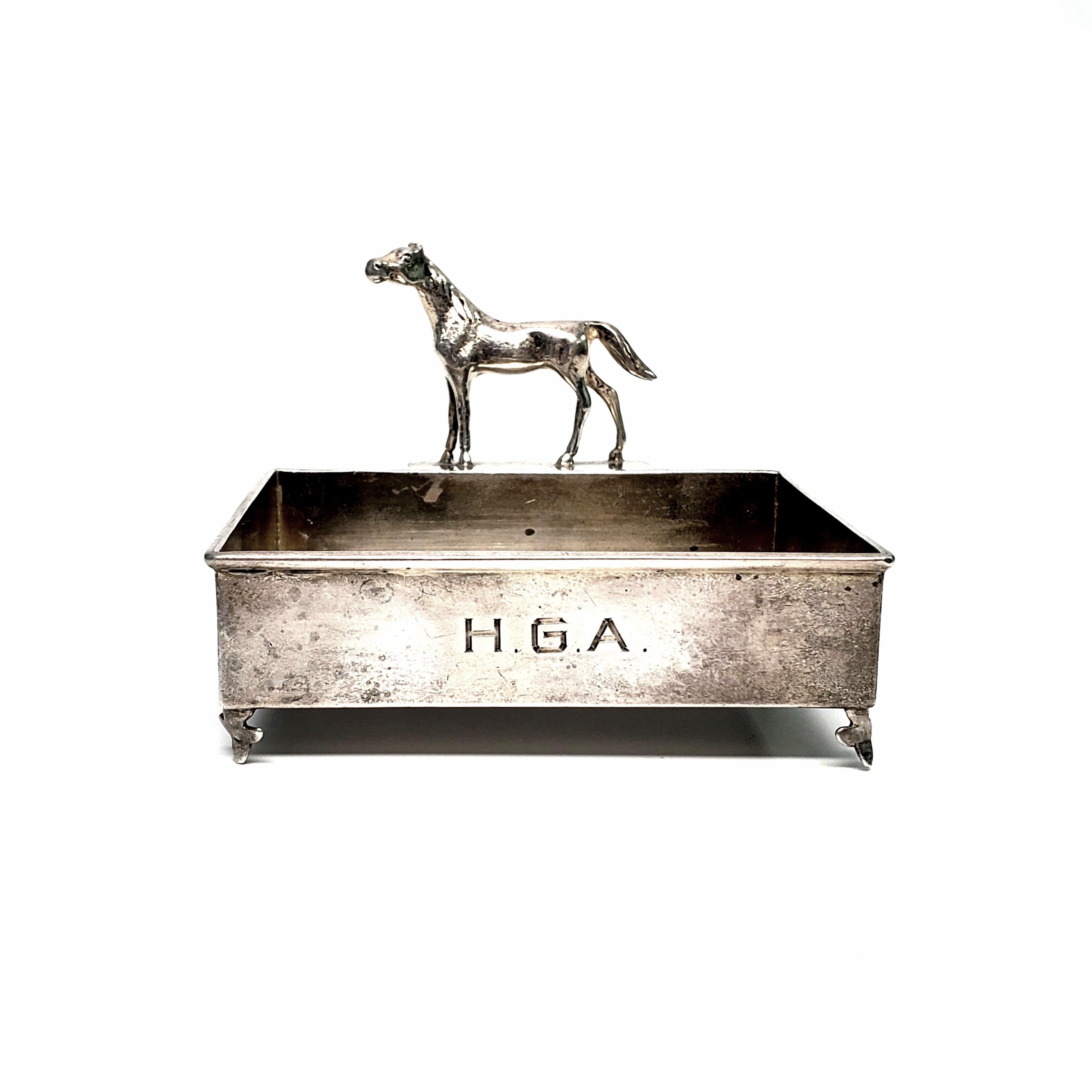 Vintage sterling silver business card holder by Herbst & Wassall.

Featuring a figural horse, this footed business card holder was designed by Herbst & Wassall, 1909-1940. Most likely sold at Gorham's sales office, was opened in 1905 on NYC's 5th
