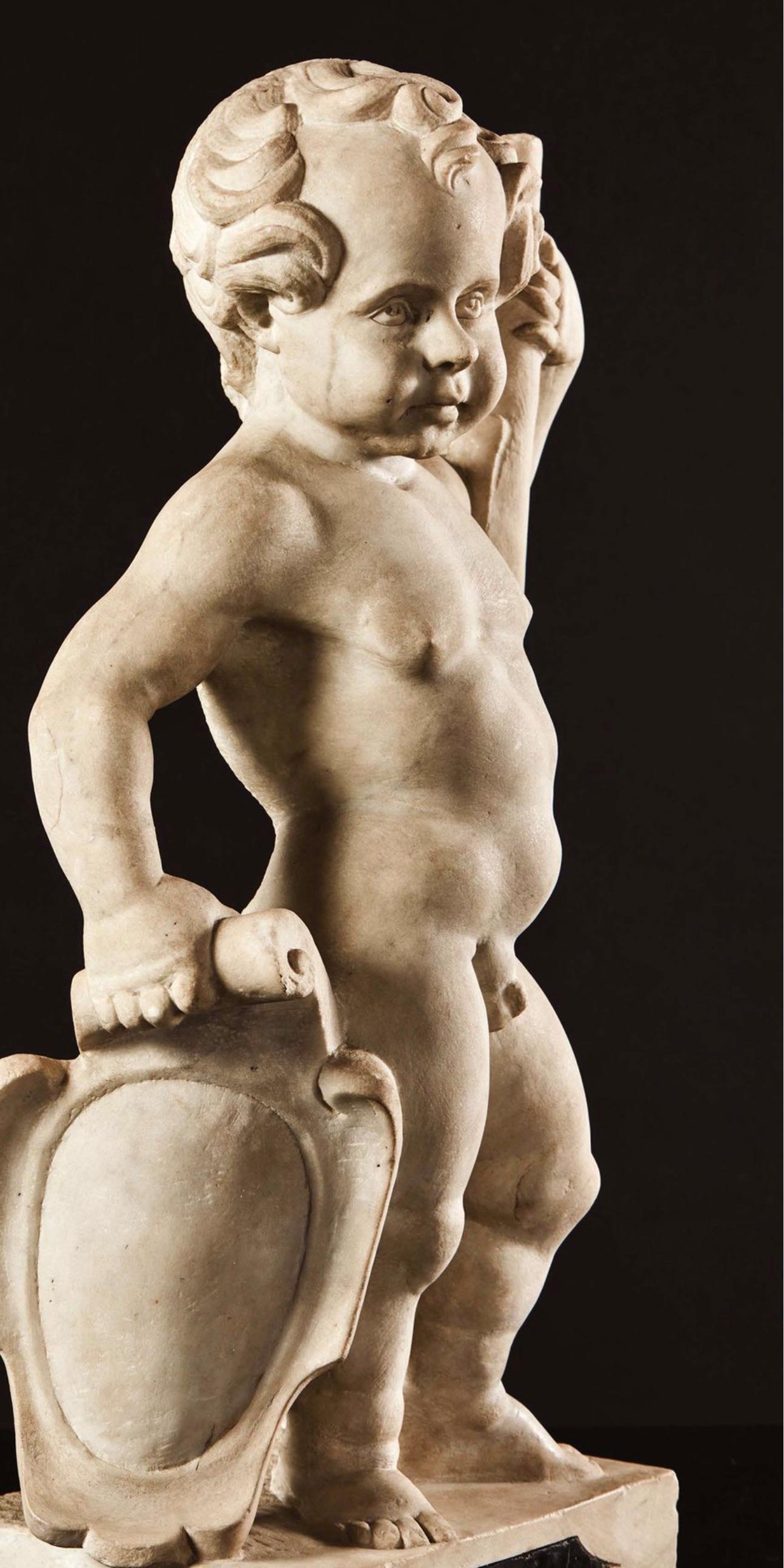 Hercules holding a coat of arms
Flemish, XVII century
White and black marble
Measures: 67 x 32 x 19 cm

Hercules is depicted naked, holding a coat of arms with the right hand and his club with his left hand. The child presents a high rounded