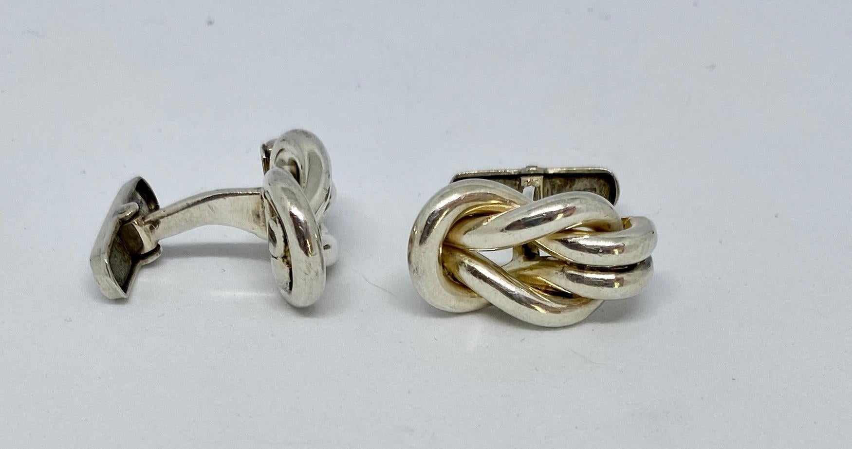 Chosen as the house symbol for the year 2021, the Hercules knot is an ancient motif symbolizing strength, love and protection long associated with Ilias LALAoUNIS.

These vintage cufflinks, hand-made in heavy, sterling silver, feature Hercules knots
