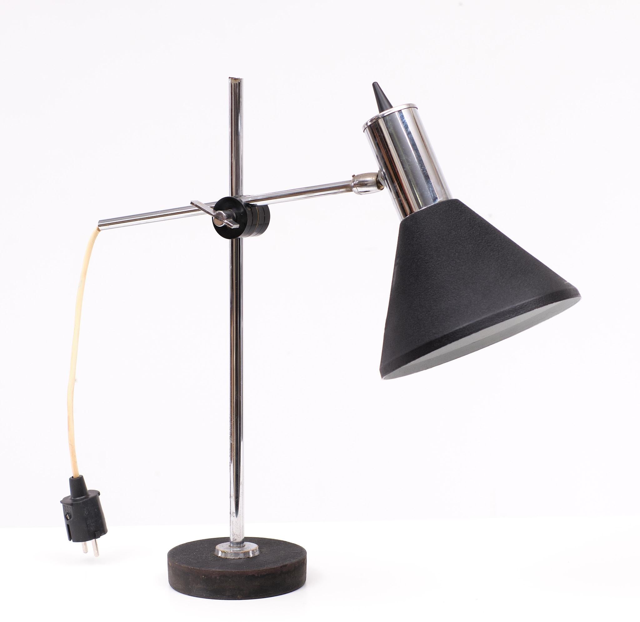 Herda desk lamp. Black Metal shade, Chrome upright. Adjustable in any 
direction. 1 large E27 bulb needed. Good vintage condition.
