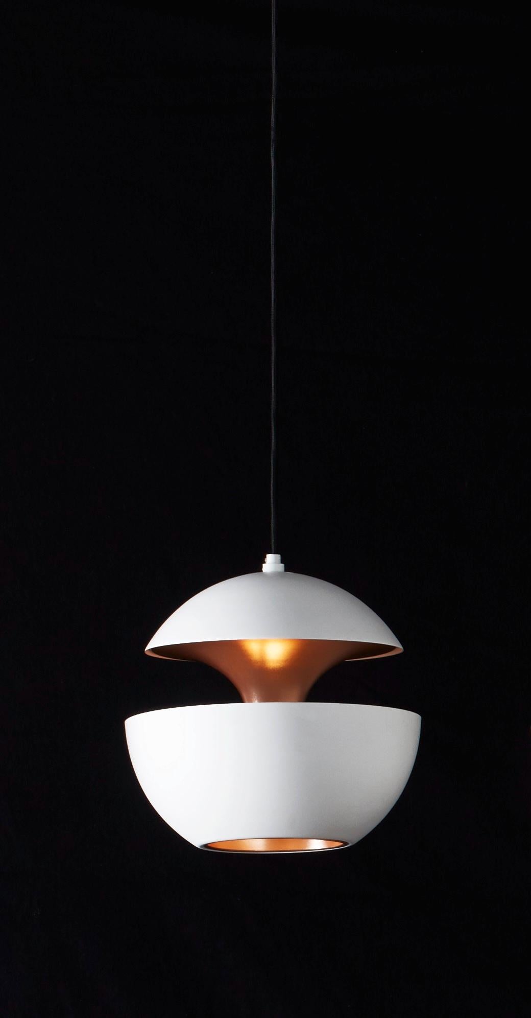 Here comes the sun small white and copper pendant lamp by Bertrand Balas
Dimensions: D 17.5 x H 17.5 cm
Materials: Aluminum
Available in different sizes and colors.

All our lamps can be wired according to each country. If sold to the USA it