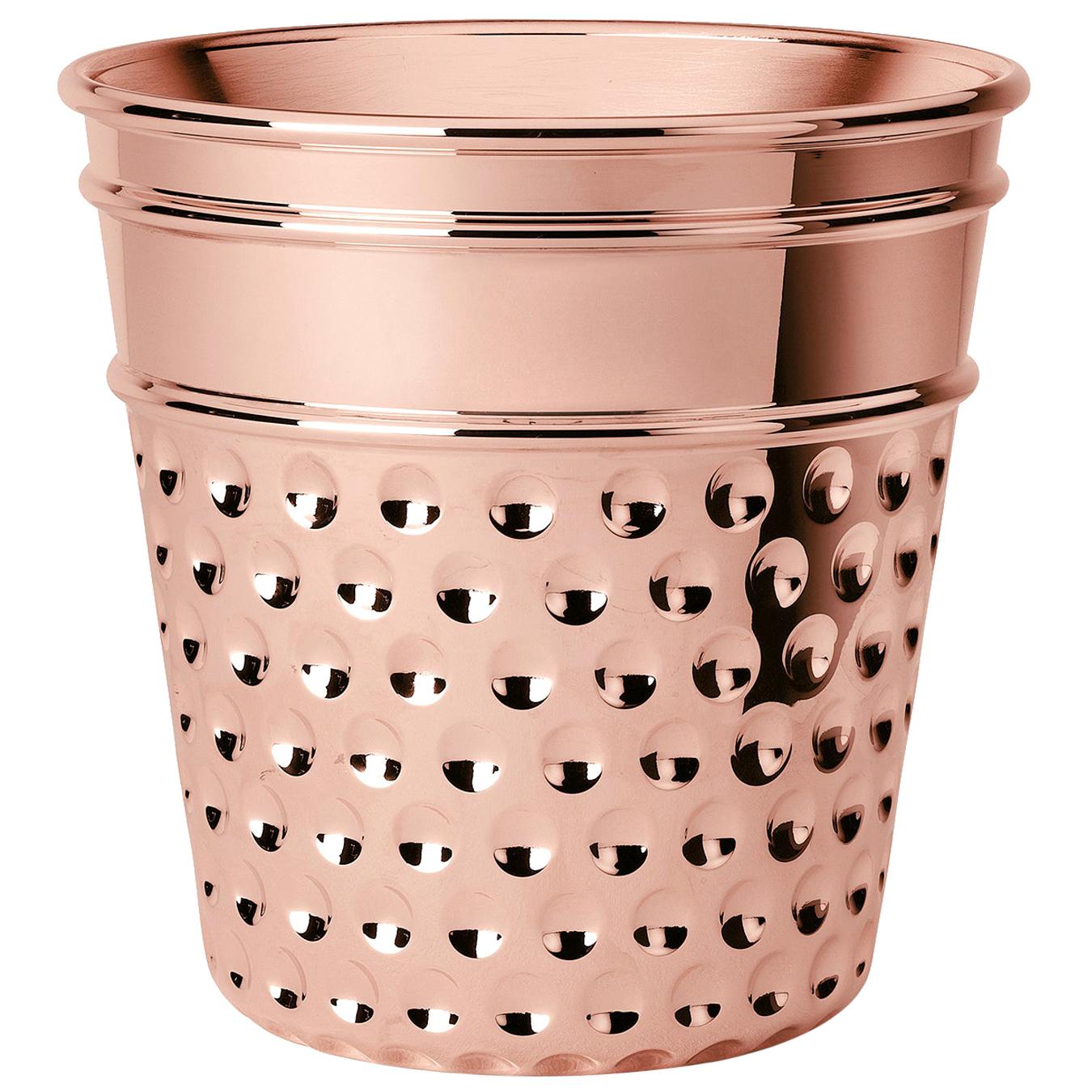 Playful charm and minimalist aesthetic characterize this timeless, copper ice bucket. Inspired by time-old tailoring , this piece takes the form of an enlarged thimble, unique for its precious details and delicate etchings. Incredibly versatile,