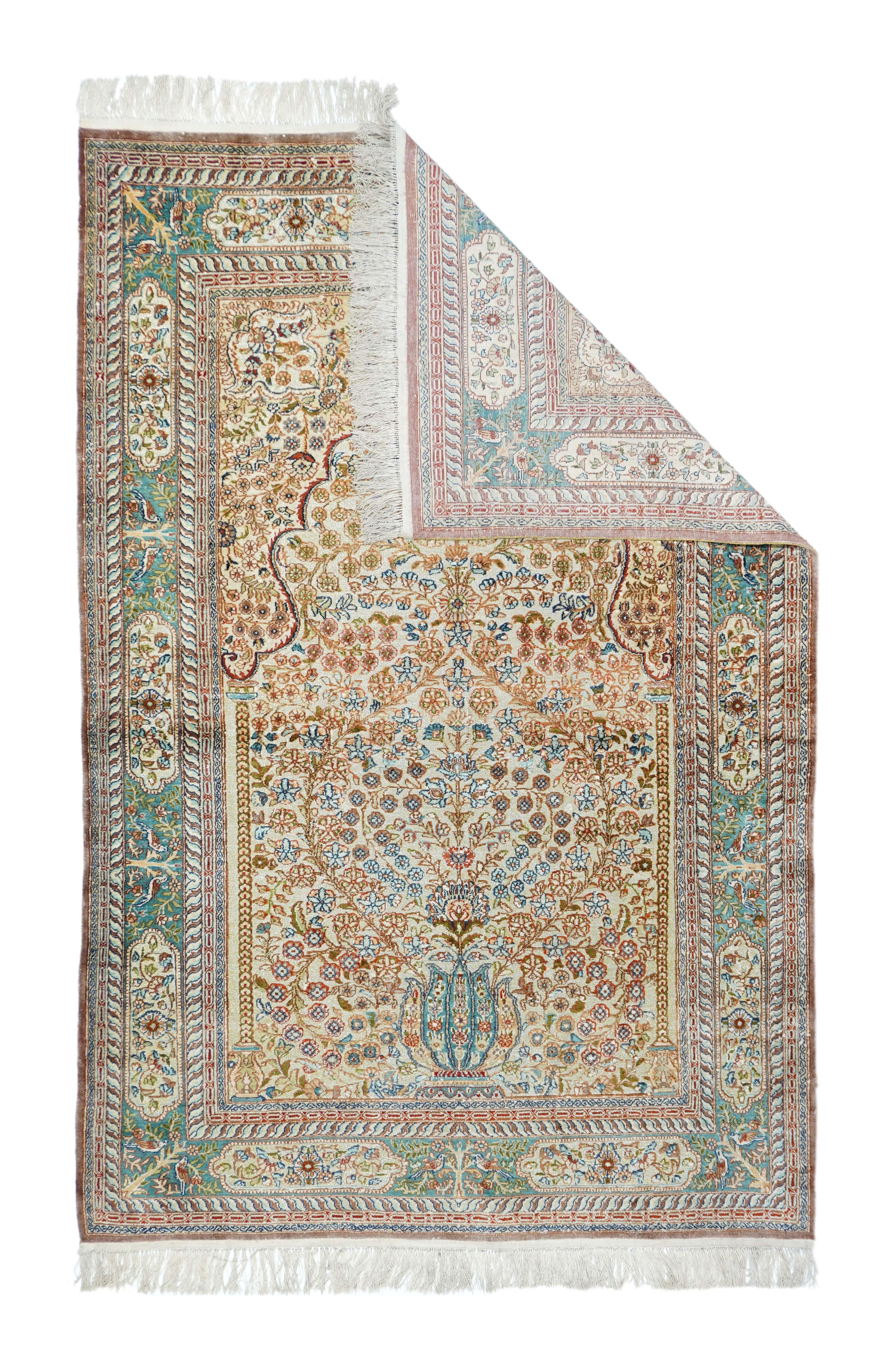 This all-silk, very finely woven NW Turkish niche-design scatter shows a straw-sand field encompassing a cusped arch, supported on slender lateral columns, and displaying a central flowering 