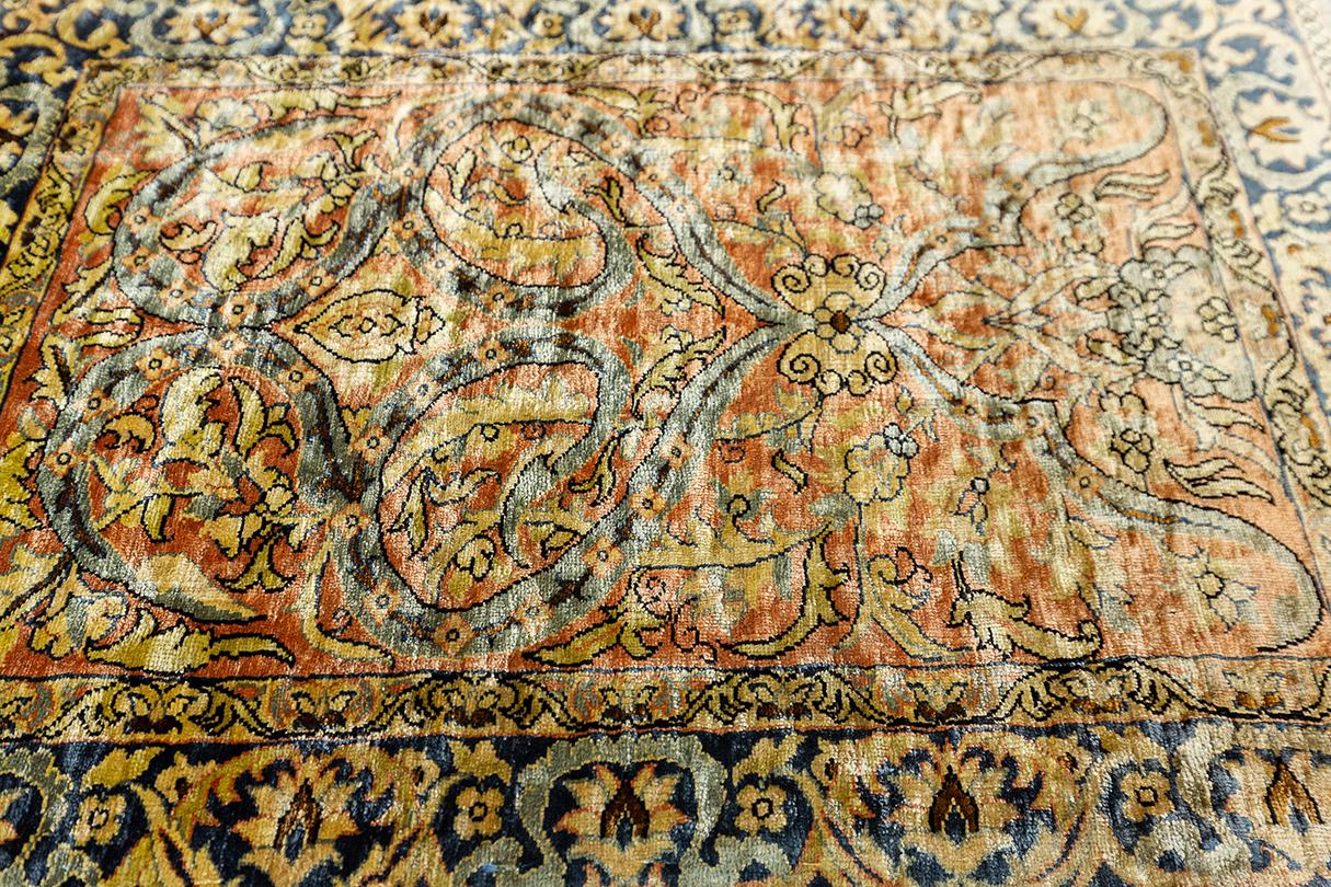 This exquisite Hereke rug, measuring 54 x 41 cm (1' 9