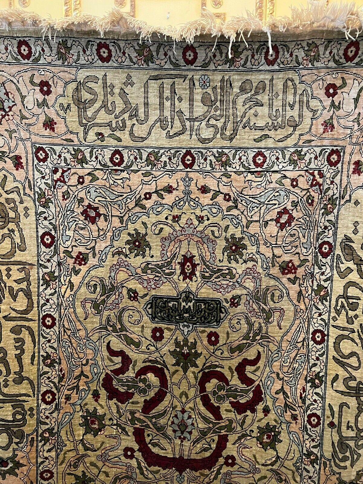 Fine silk carpet Hereke region.

With Persian writing above and right-left.