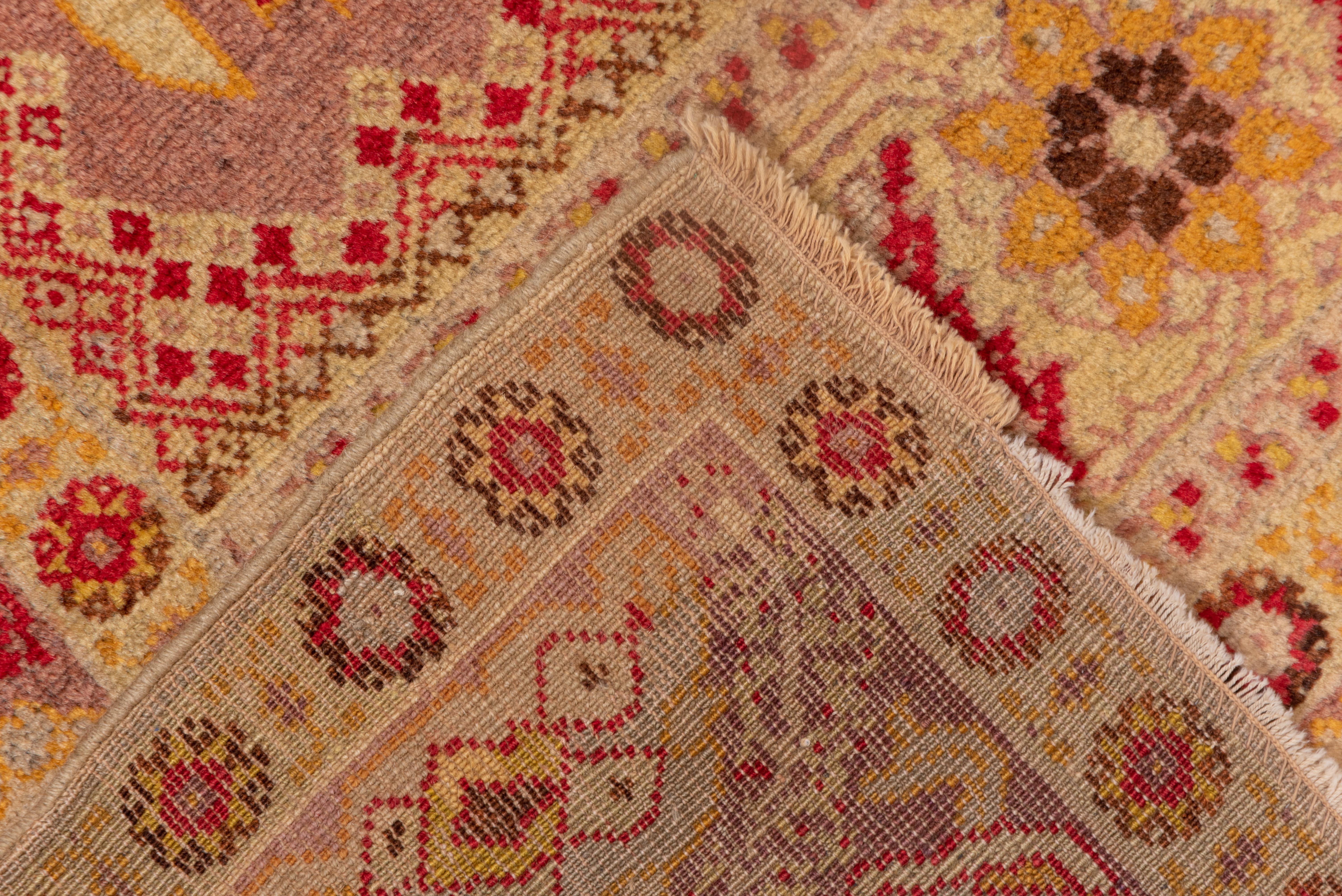 Hand-Knotted Hereke Tribal Rug in Golden Reds and Orange Tones For Sale