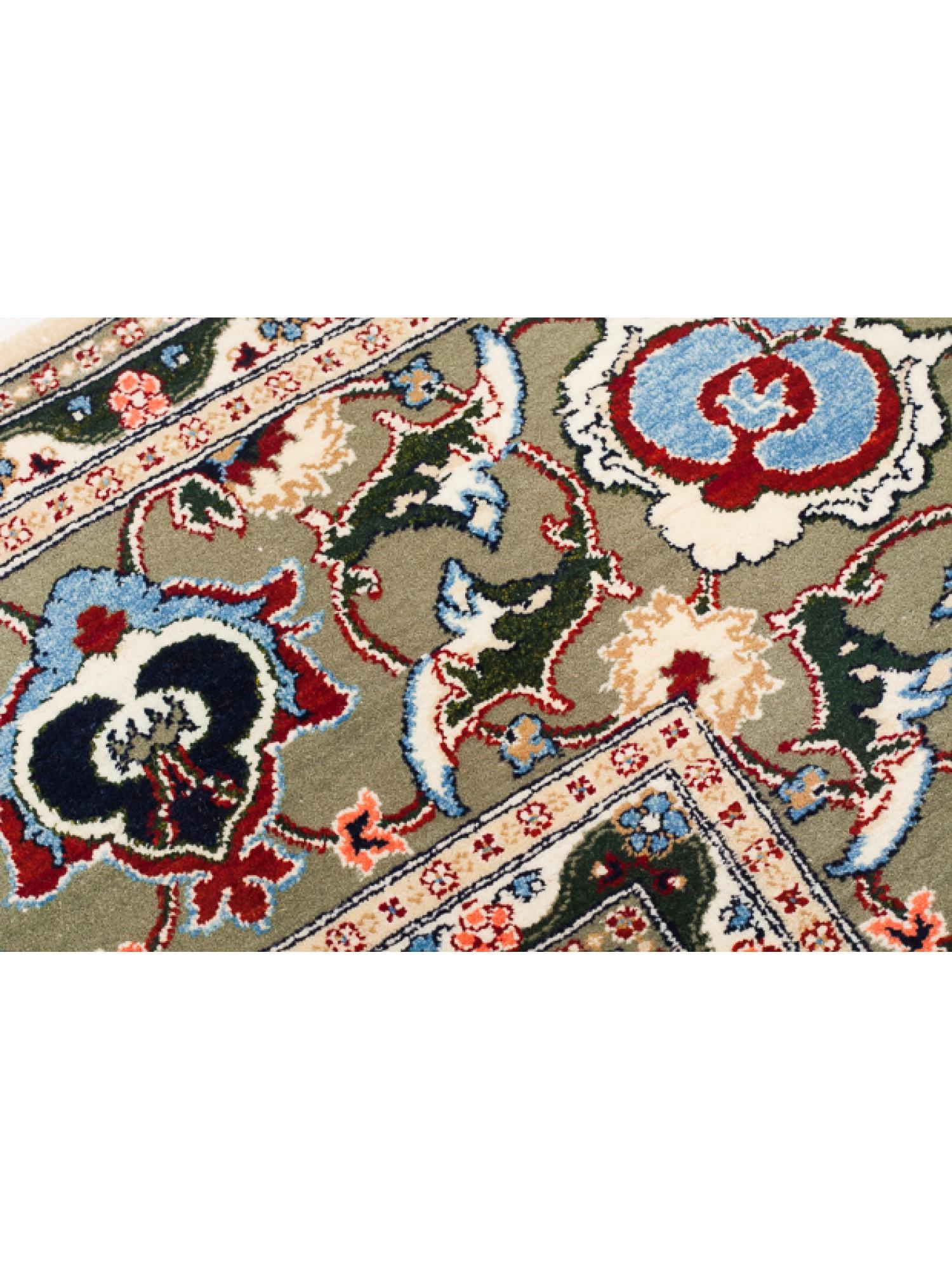 This unique Wool Hereke Carpet is among the highest-quality carpets in the Hereke workshop. There is a flower lattice on a beige background and light khaki green with the fineness of the weave, the use of color, and the elegant and sophisticated