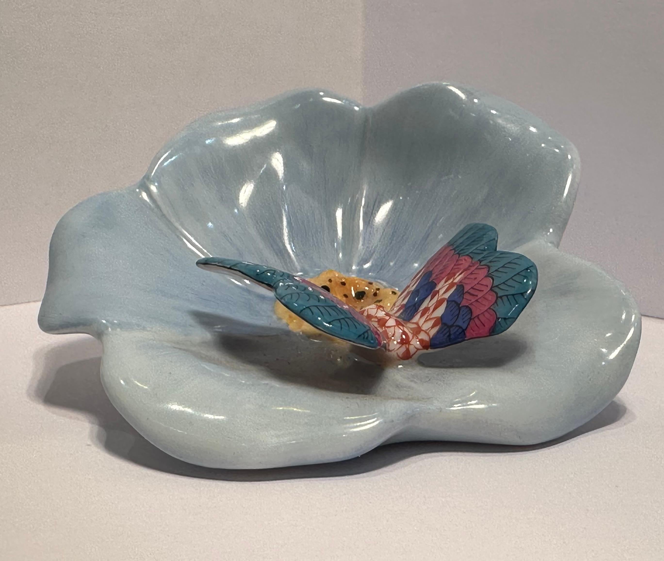 Beautifully handmade estate porcelain Herend Queen Victoria Butterfly on Flower has been expertly hand-painted by the legendary Hungarian master artisans of Herend. Special rust fish scale design with blue, raspberry and teal make up the intricate