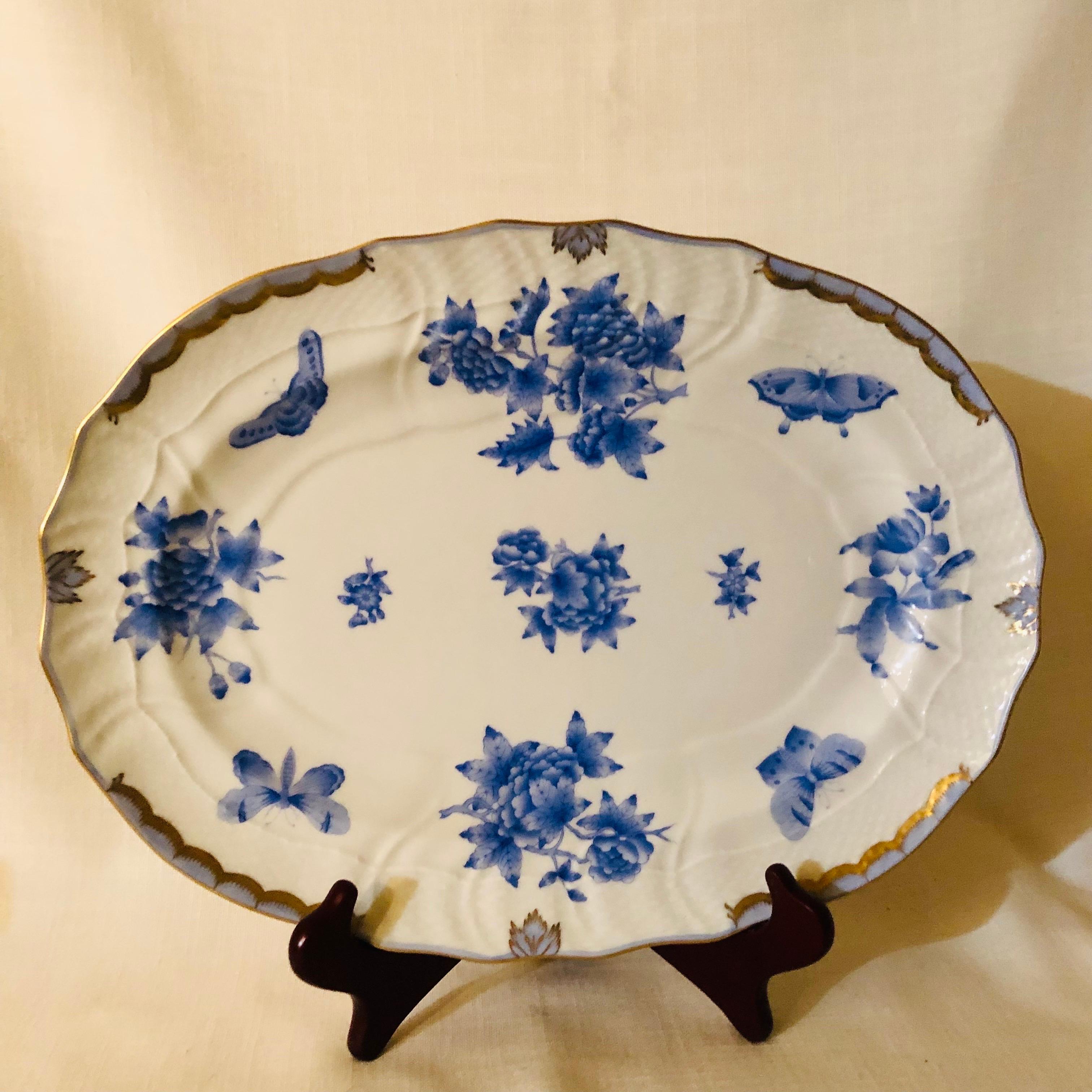 This is a fabulous Herend Fortuna 17 inch oval platter hand-painted with blue butterflies and flowers on a white ground with accents of 24 karat gold. This platter would make a wonderful addition to your dinner service to serve any delicious entree.