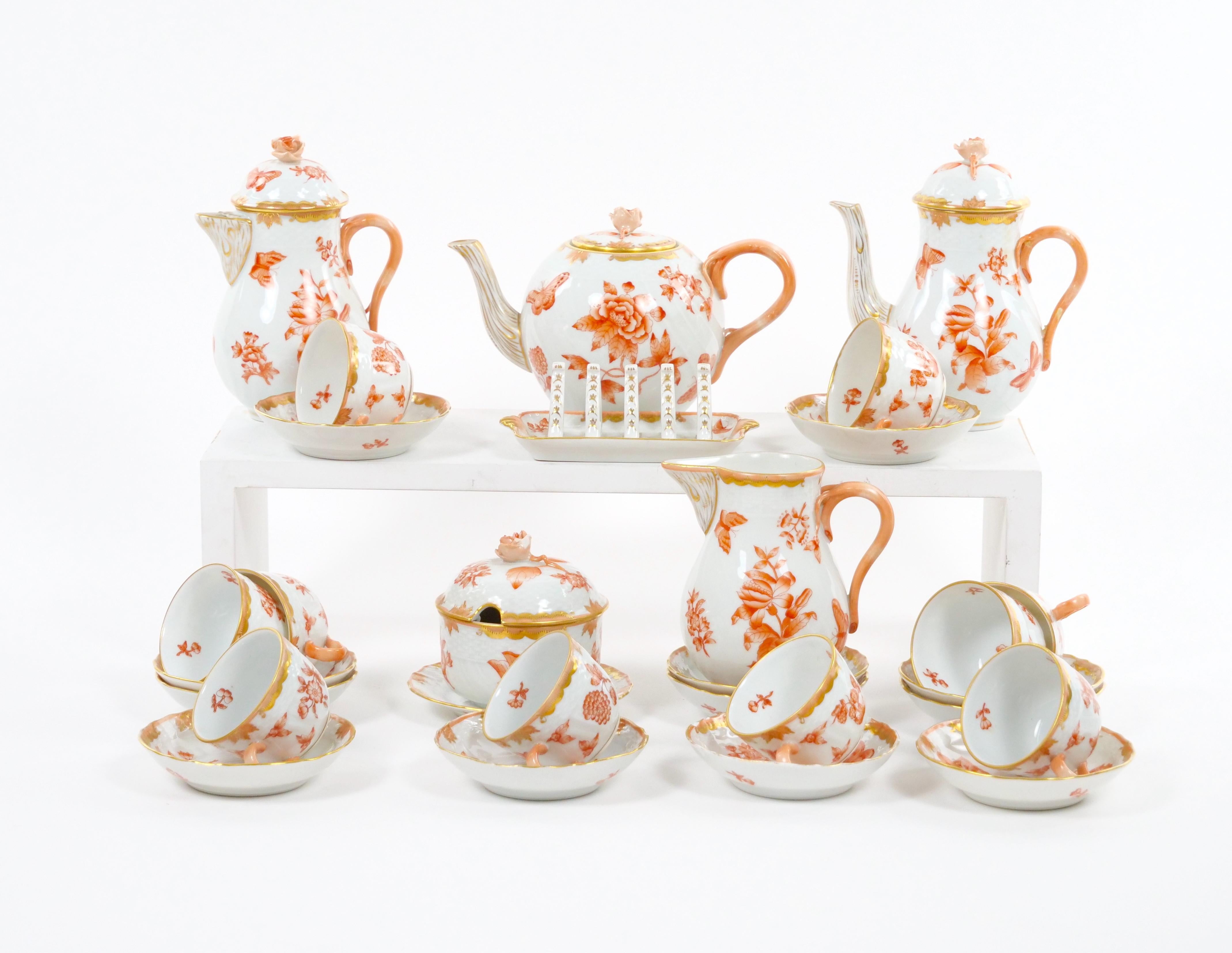 
Introducing an extraordinary Hungarian hand-painted and gilt decorated coffee service by Herend, renowned for their exquisite craftsmanship. This magnificent glazed porcelain set, designed to accommodate ten people, combines elegance, artistry, and