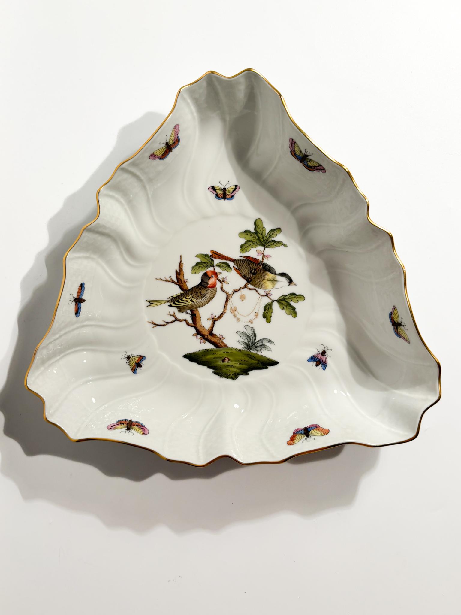 Porcelain pocket emptier centrepiece, made by Herend in the 1950s

Ø cm 24 Ø cm 26 h cm 5

Herend porcelain is among the most prestigious and sought after in the world. Made in Hungary since 1826, Herend is known for its exceptional quality,
