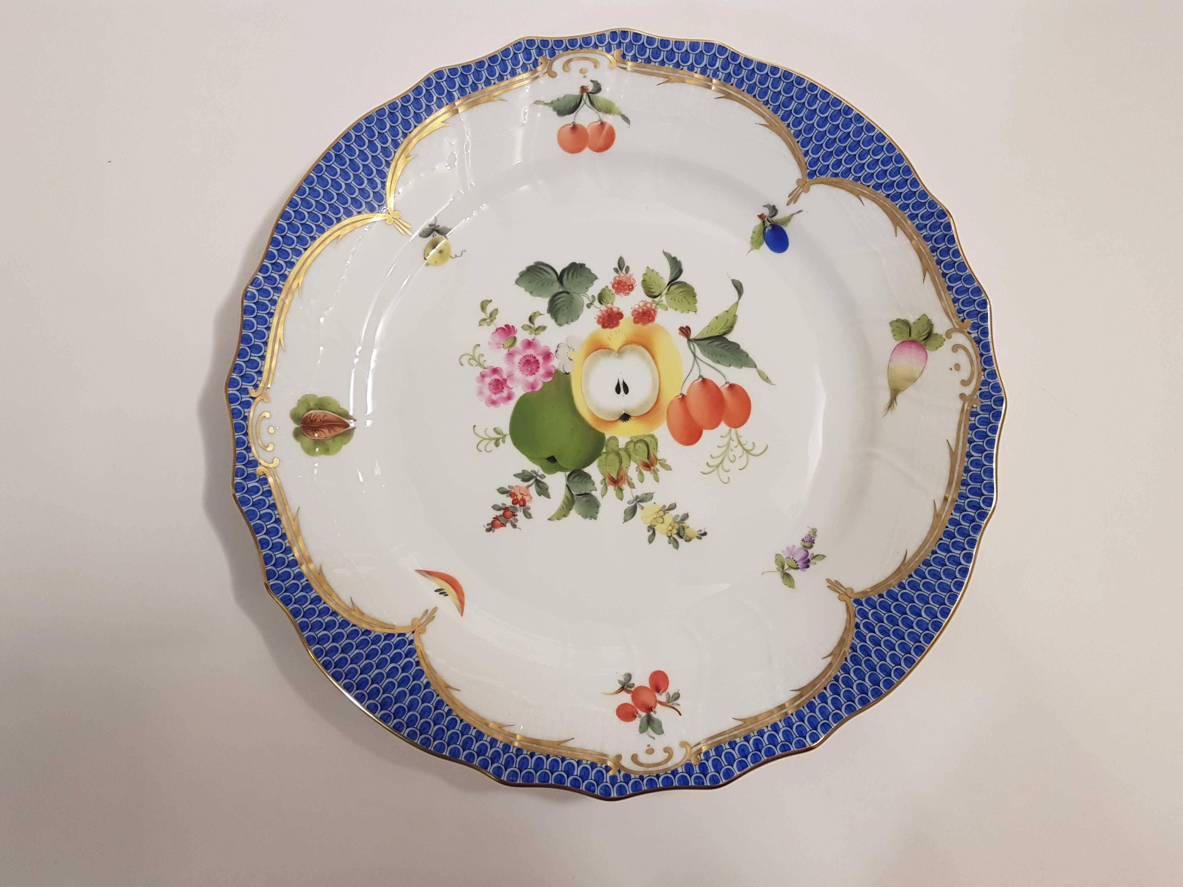 Interesting, colorful pair of hand-painted Hungarian porcelain plates to hang on wall by Herend.
