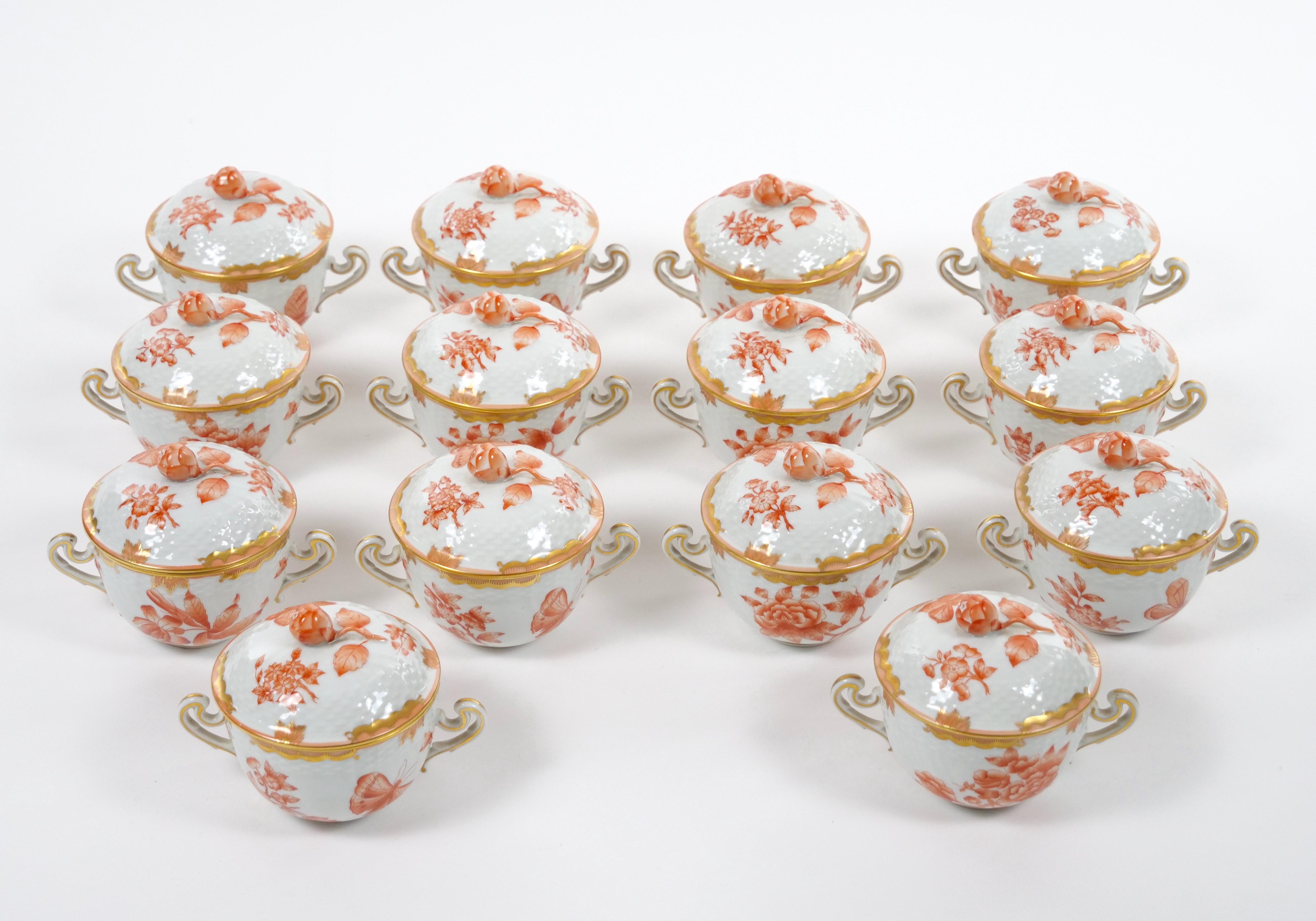 
Indulge in the luxurious charm of the Herend Hungarian porcelain hand painted and decorated covered pot de creme service, meticulously crafted to delight and captivate your senses. This exceptional set is designed to serve up to 12 people,