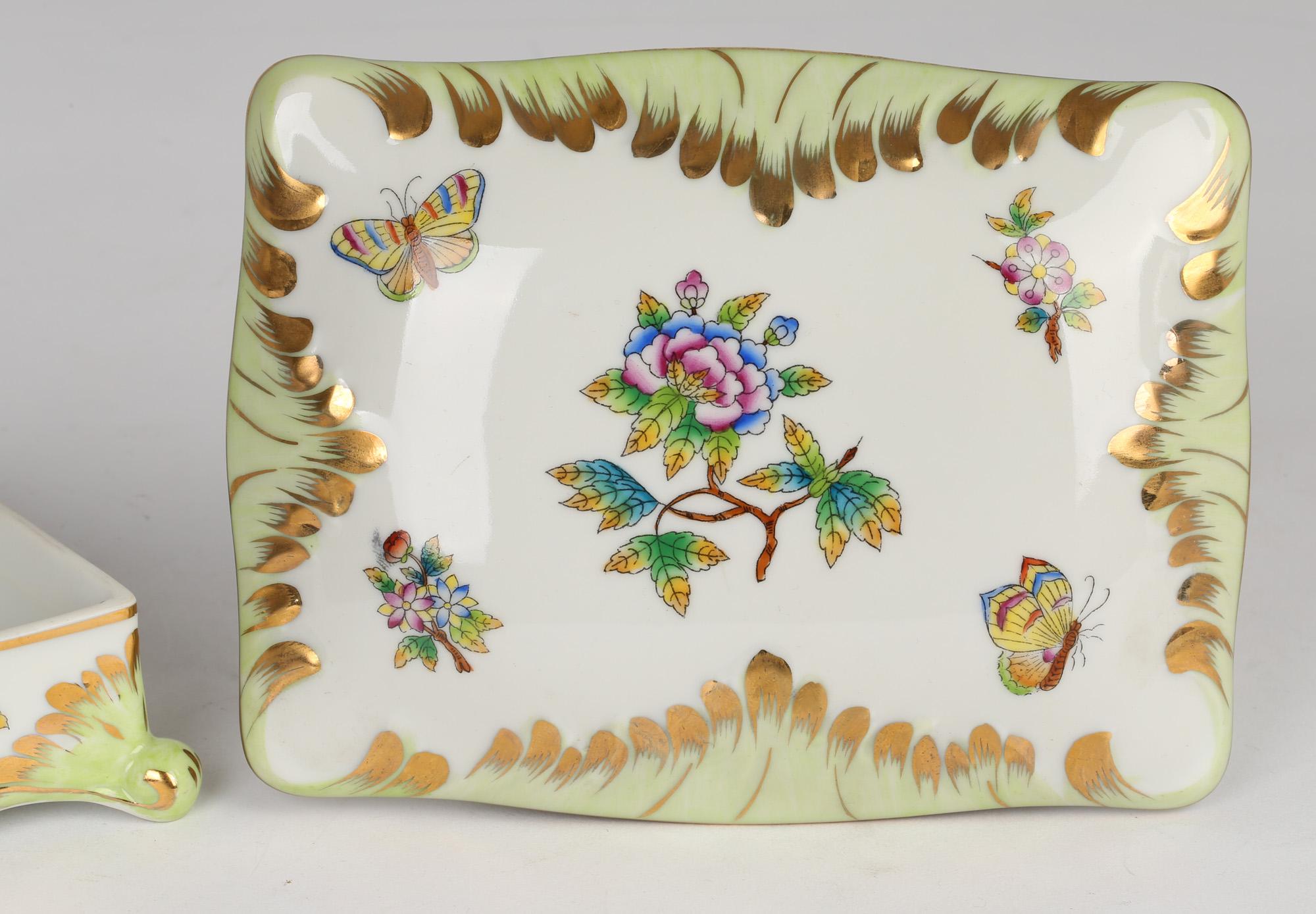 A very finely made Hungarian porcelain dressing table lidded box hand-painted with floral and butterfly designs by Herendi Porcelánmanufaktúra (Herend Porcelain Manufactory) probably dating from the mid 20th century. The rectangular shaped box