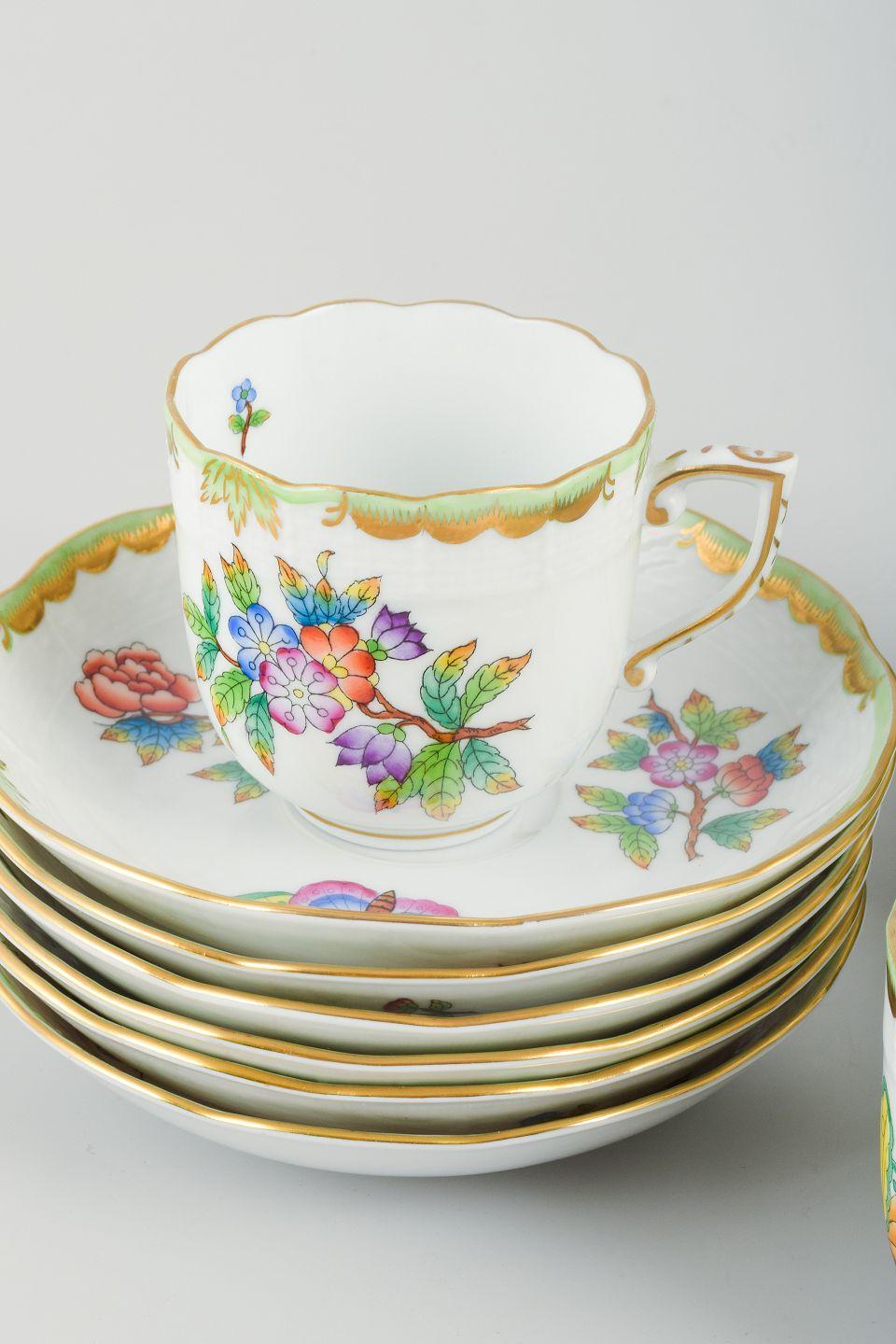 PRE-OWNED GOODS ARE EXEMPT FROM IMPORT TARIFFS FOR U.S., UK, AUSTRALIAN & CANADIAN CUSTOMERS.   
THEREFORE, NO IMPORT TARIFFS WILL BE APPLICABLE TO YOUR PURCHASE. 

Herend, Hungary.
A six-person “Queen Victoria” porcelain coffee set.
Comprising