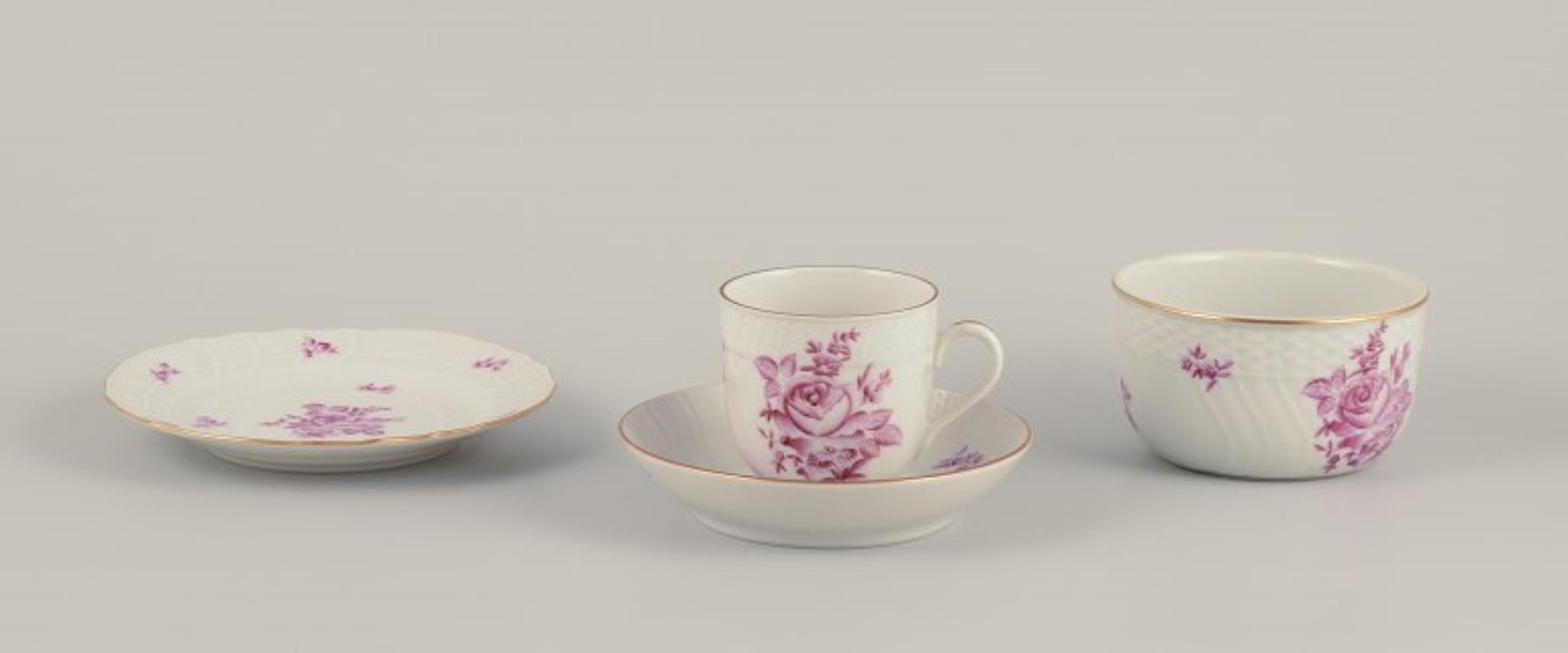 Herend, Hungary.
A complete three-person coffee set in porcelain.
Comprising three coffee cups with saucers, three cake plates, and a sugar bowl.
Hand-painted with purple floral motifs.
Mid-20th century.
Marked.
Perfect condition.
Coffee cup: D 7.0