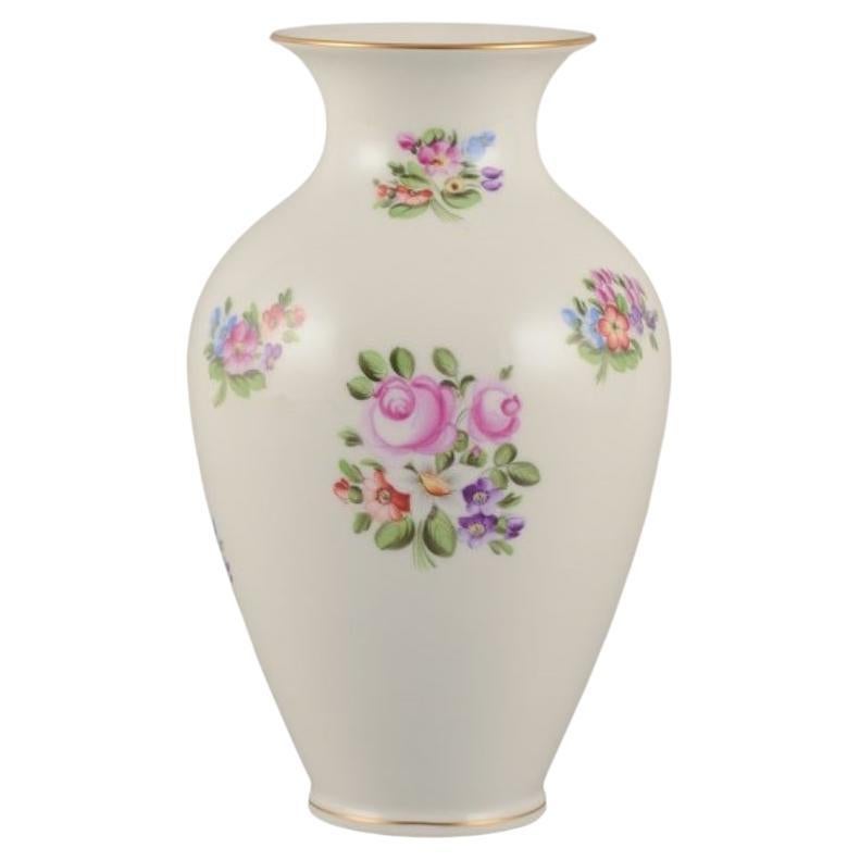 Herend, Hungary. Large porcelain vase hand-painted with flower motifs
