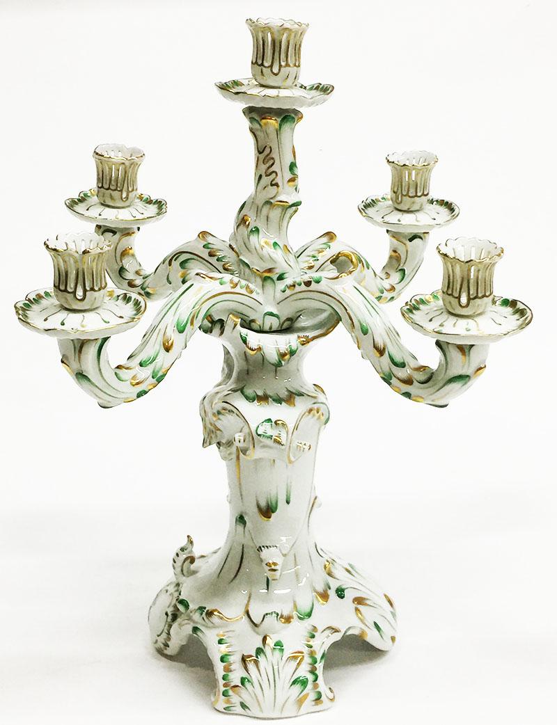 Herend Hungary porcelain large Baroque style green and gold candelabra

A Herend Hungary porcelain 5 arms very large candelabra of 42 cm high
In Baroque style with a lot of curls, painted in green and gold
The base is in any way you look