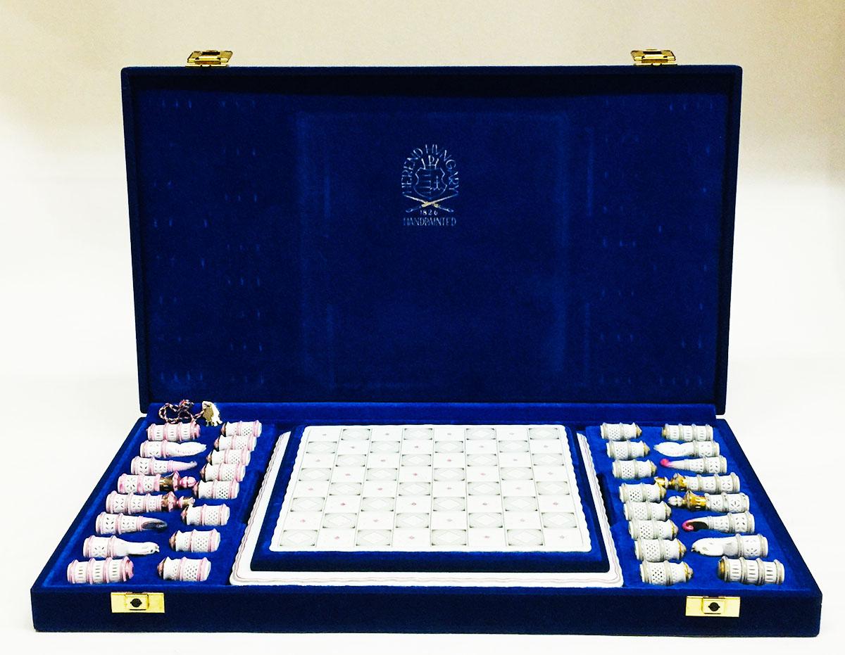 Herend Hungary porcelain limited edition chess set 2006 with board in blue case

Herend has this chess set designed and made available on custom order only
Herend Hungary 2006 hand painted porcelain chess figurines and 2 pieces board in pink/grey