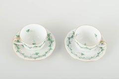 Herend, Hungary. Porcelain set of 2 demitasse cups with saucers, mid-20th C.