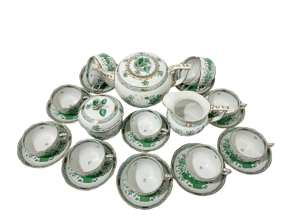 Herend Hungary Porcelain Tea set for 12 persons, Indian Basket Green pattern

A Herend porcelain tea set for 12 persons with the Indian Basket pattern. Original it is the East Indies flowers. Herend Hungary Porcelain colored green exists of twelve