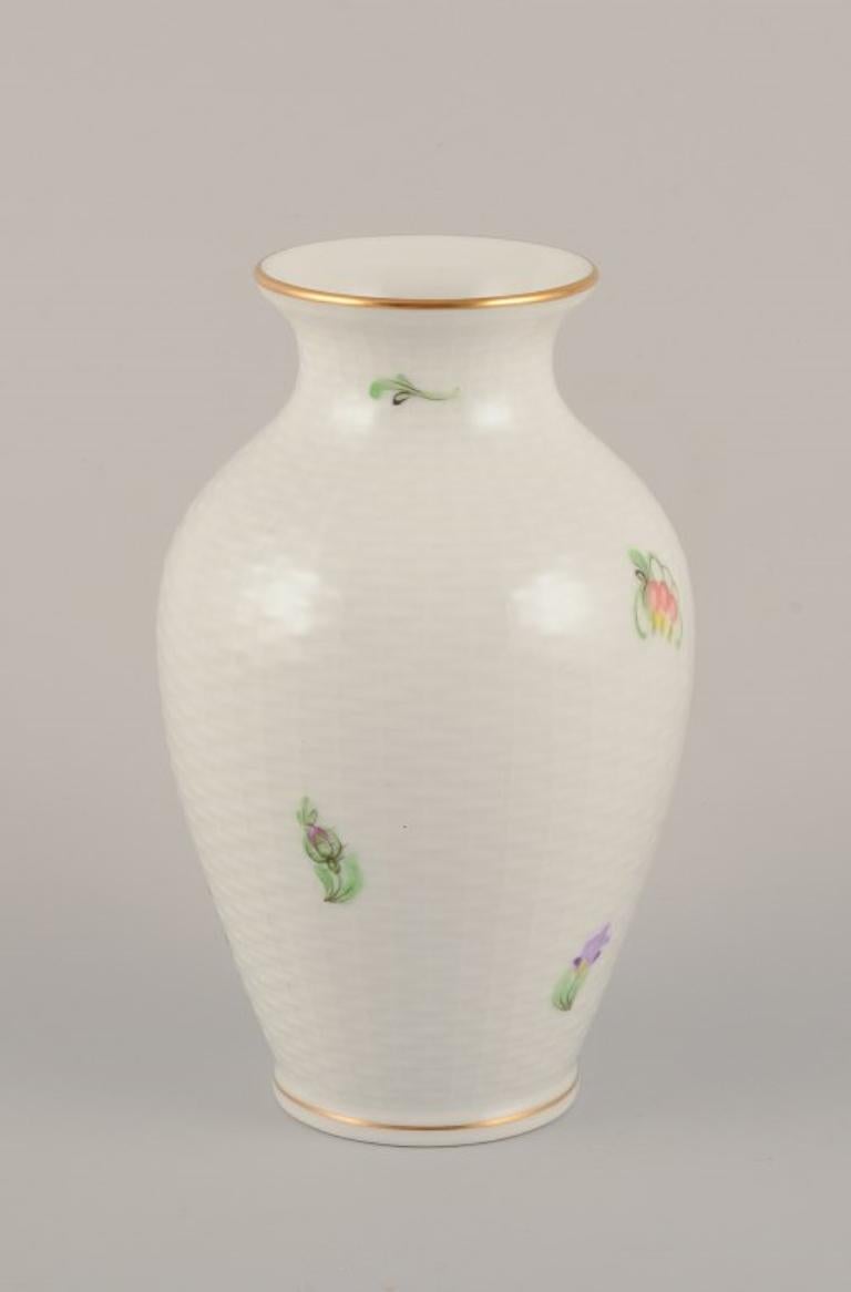 Herend, Hungary. Porcelain vase hand-painted with polychrome flower motifs and gold edge.
Mid-20th century.
Marked.
In perfect condition.
Dimensions: Height 14.5 cm x Diameter 8.5 cm.
