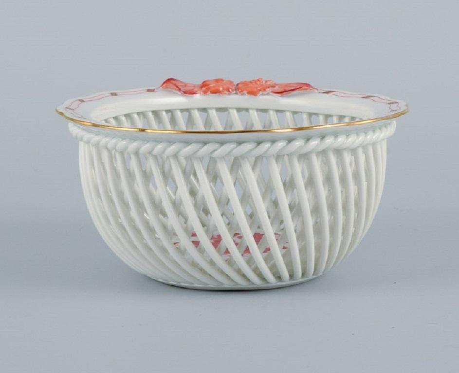 Herend, Hungary, reticulated porcelain bowl, hand painted with orange flowers.
Mid-20th Century.
Perfect condition.
Marked.
Dimensions: D 10.0 x H 5.0 cm.