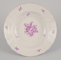 Herend, Hungary. Set of four deep plates with purple floral motifs