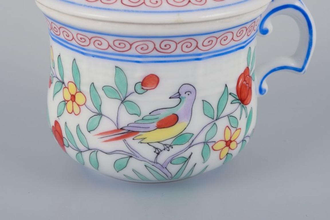 Late 20th Century Herend, Hungary, two porcelain bouillon cups, with flowers and birds