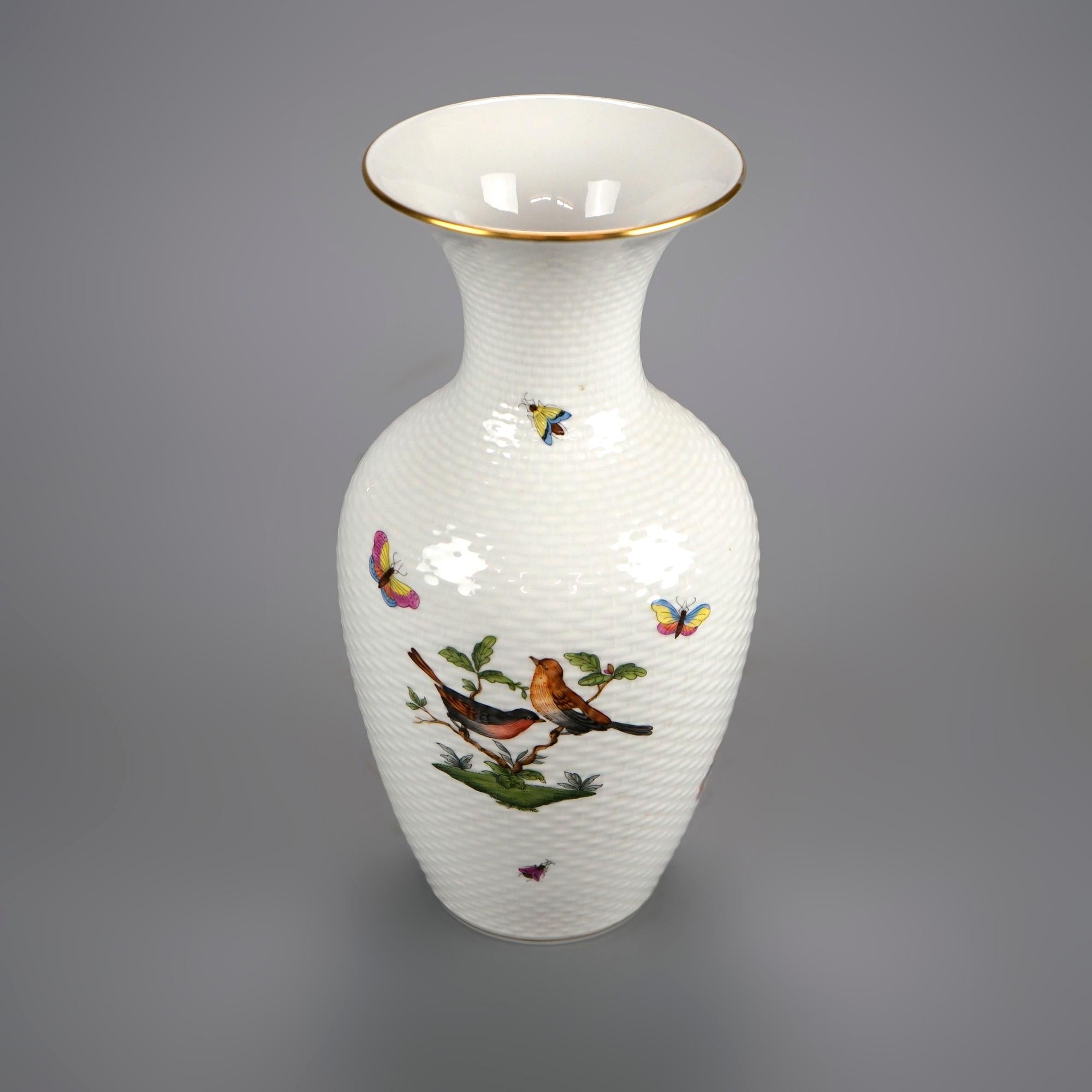 A vase by Herend offers porcelain construction with flowers, butterflies, birds and gilt highlights, maker mark on base as photographed, 20th century

Measures- 10''H x 5''W x 5''D.