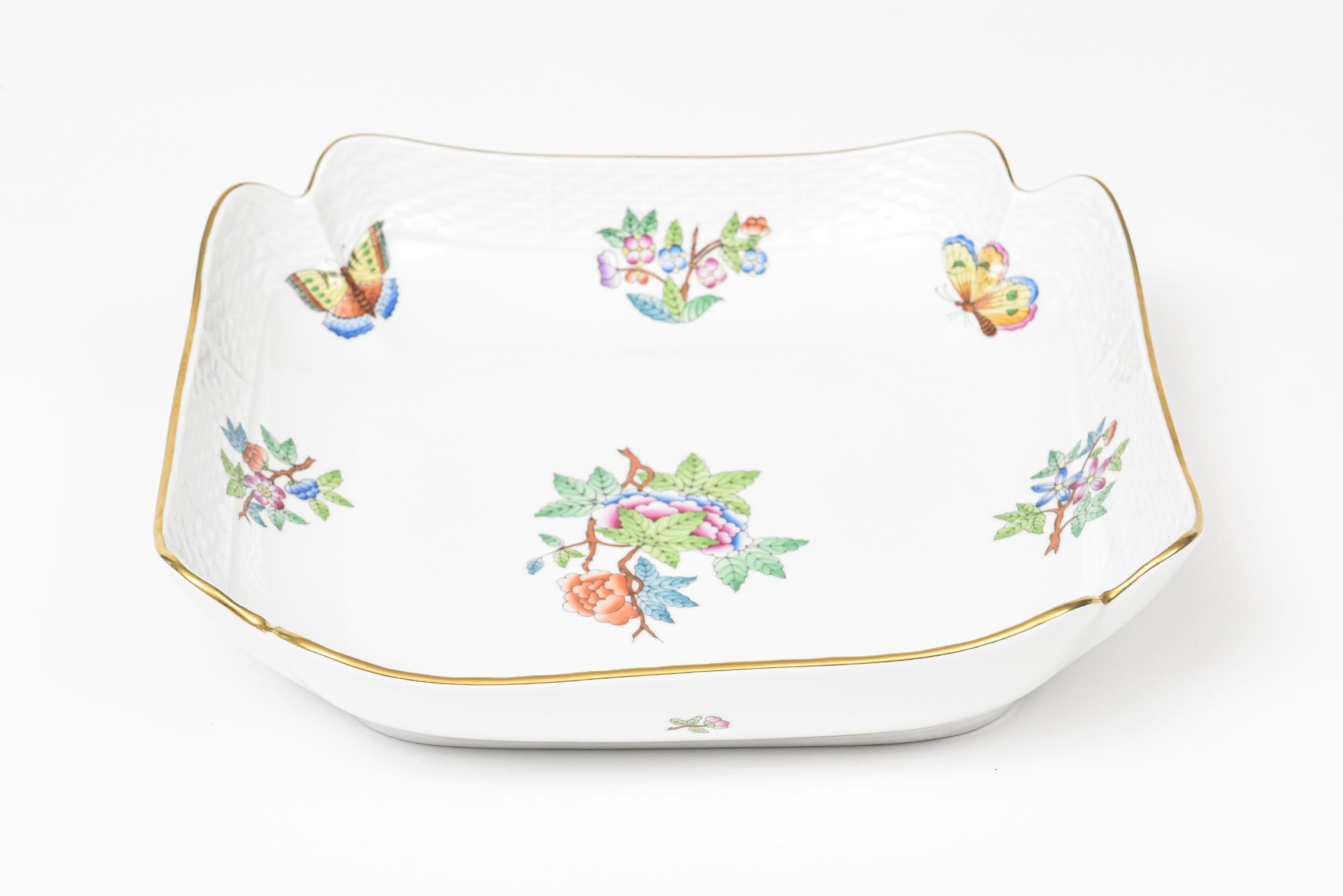 Herend Queen Victoria older shallow square fruit or salad serving bowl.
The original pattern, introduced in 1851 at the First World Exhibition in London, was purchased by Queen Victoria herself. Subsequently named for her, this Chinese-influenced