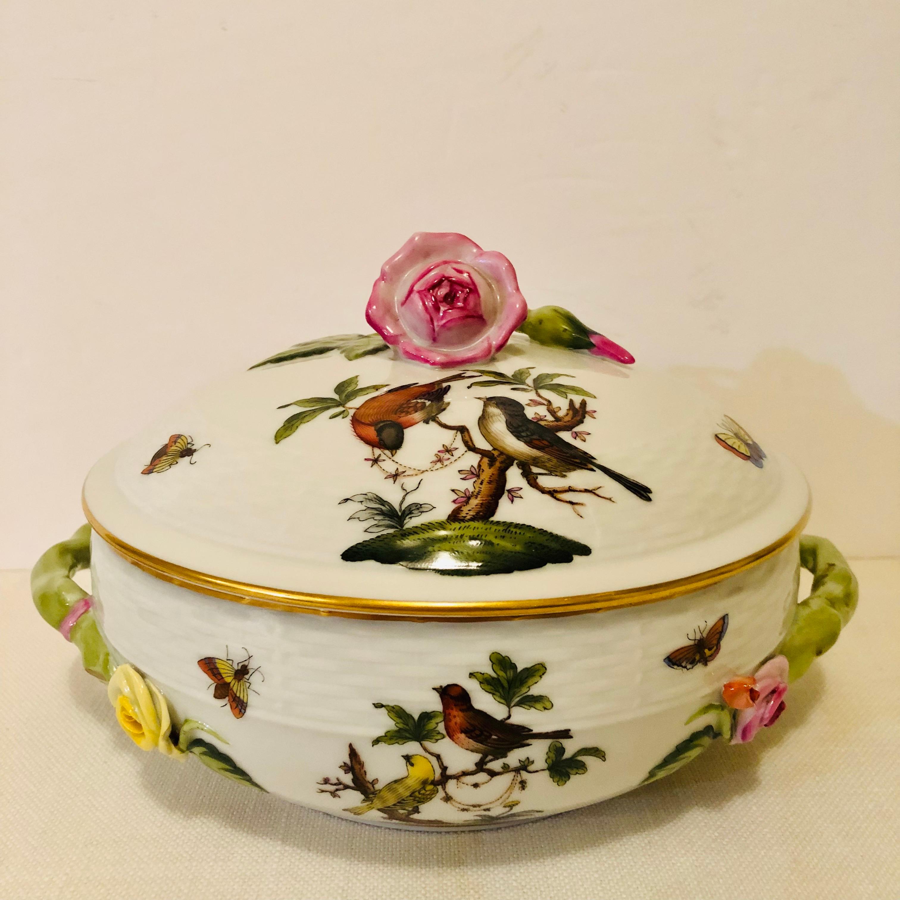 This is a wonderful rare and beautiful Herend covered bowl in the Rothschild Bird Pattern. On the bottom of this covered bowl, you can see the wonderful paintings of the pairs of birds on each side surrounded by accents of colorful butterflies and