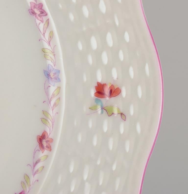Hand-Painted Herend, set of twelve porcelain plates with polychrome floral motifs. For Sale