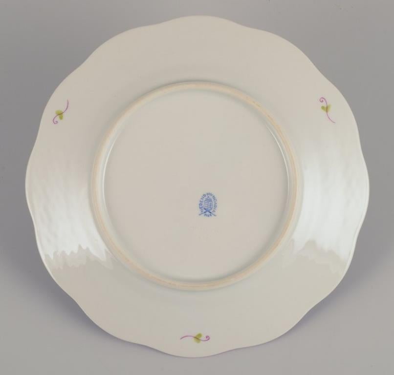 Porcelain Herend, set of twelve porcelain plates with polychrome floral motifs. For Sale