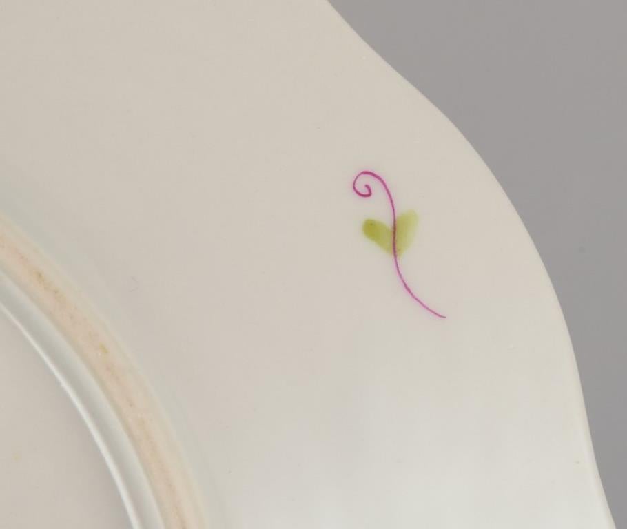 Herend, set of twelve porcelain plates with polychrome floral motifs. For Sale 1