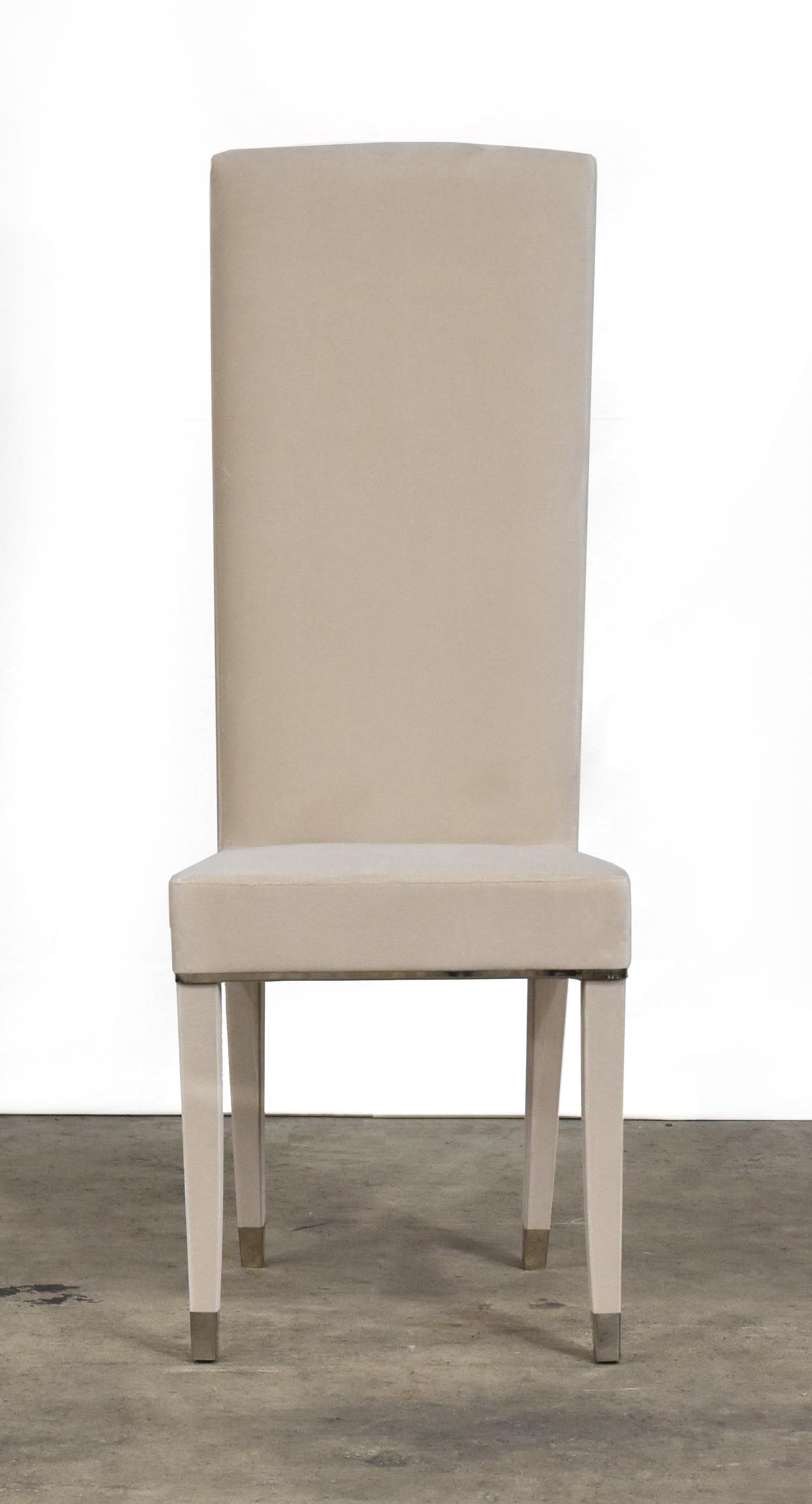 The plisse is an elegant high back chair with a plisse detail on the back. Upholstered in quartz grey velvet with steel detail.
      