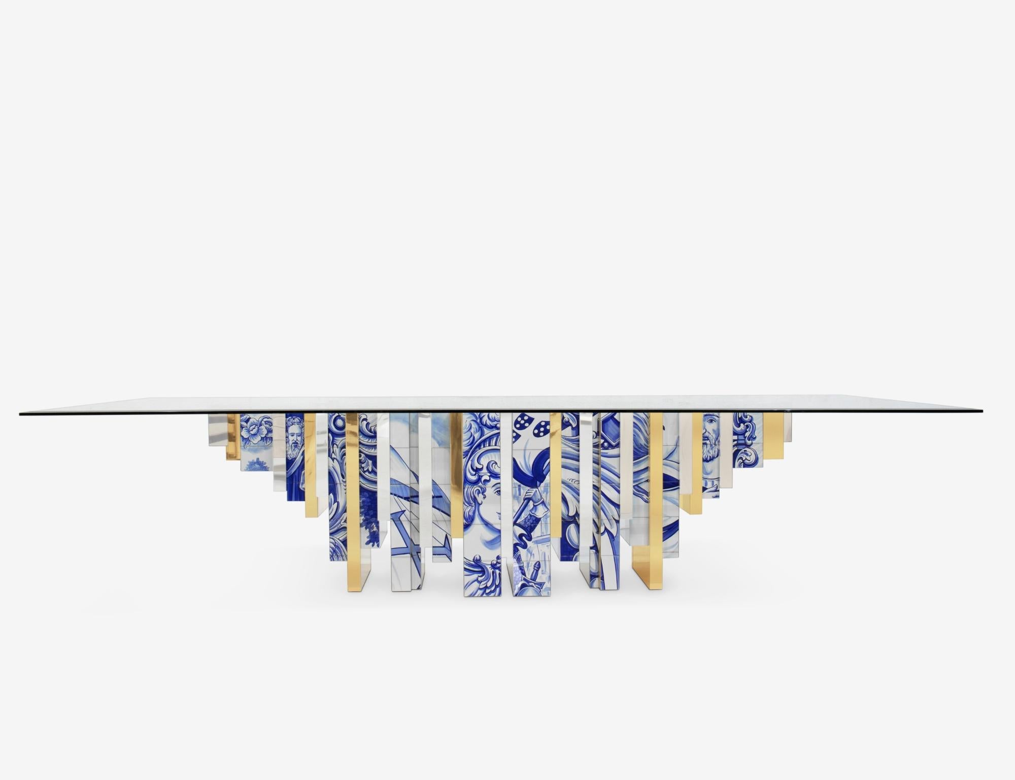The Heritage Dining Table, much like its sibling Heritage Sideboard and Cabinet, is a highly sophisticated piece inspired by Portuguese history through the use of traditional hand painted azulejo tiles. Its noble design features bold lines, with